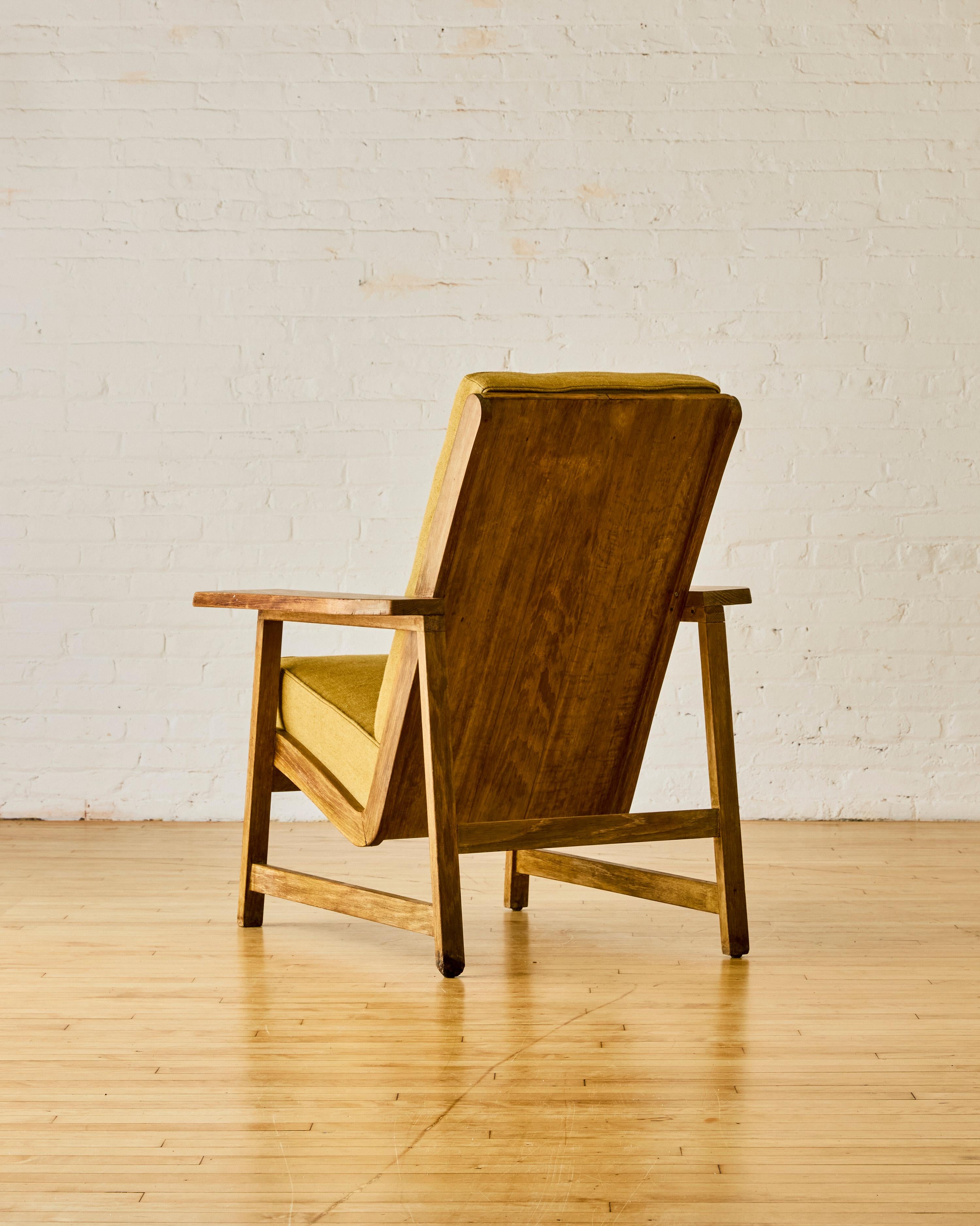 Craft movement wood lounge chair made of both solid wood and plywood, with newly upholstered tufted linen cushions that are removable. 