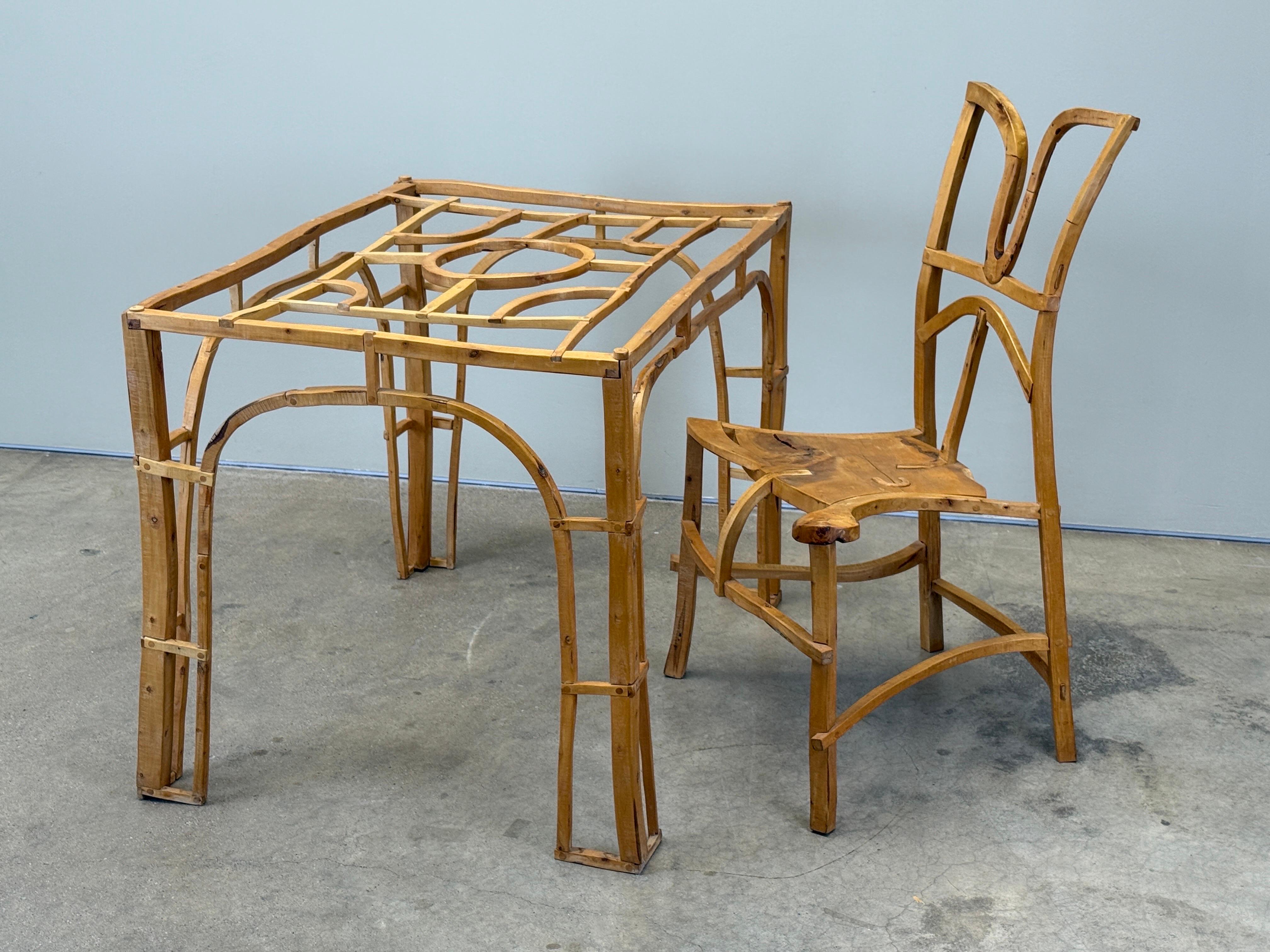 An incredibly crafted table and chair by Jonah Meyer, 1997. From the collection of Sylvia and Garry Knox Bennett.