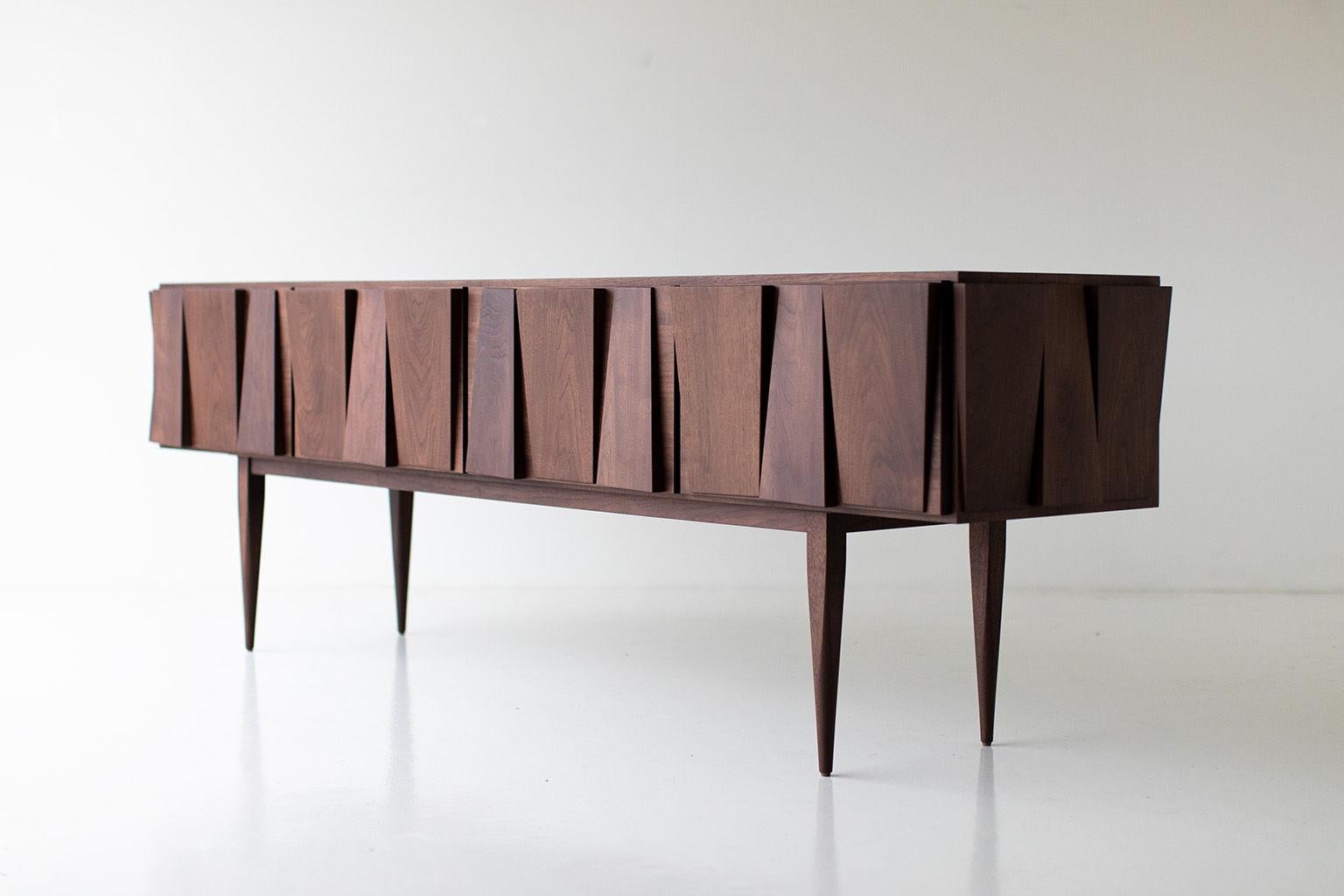 CraftAssociates console, modern console table, walnut, Cambre Collection

Craft Associates® Furniture is expertly crafted. The credenza is constructed from solid hardwood by hand, not machine. The walnut is then shaped by artisans and finished