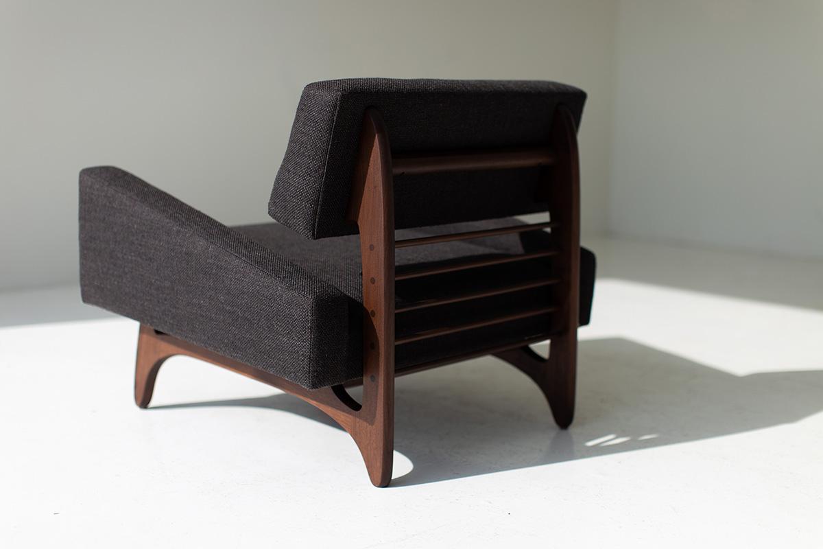 Craft Associates lounge chair, modern lounge chair, black and walnut, Vancouver 

This Vancouver lounge chair for Craft Associates® Furniture are expertly crafted and upholstered. Each chair boasts handcut foam and high grade commercial fabric.