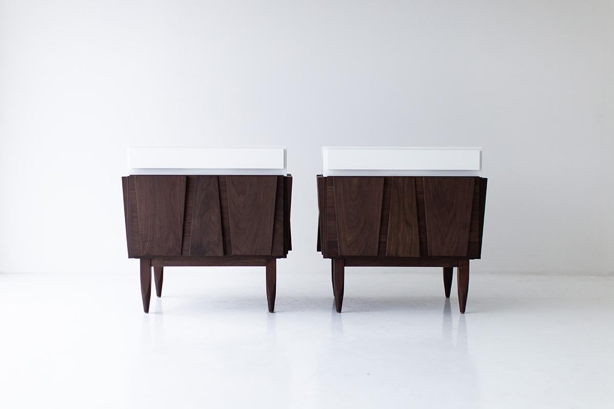 CraftAssociates nightstands, modern walnut nightstands, white and walnut, eiger

These modern walnut nightstands are expertly crafted. These are constructed from solid hardwood by hand, not machine. The walnut is then shaped by artisans and finished