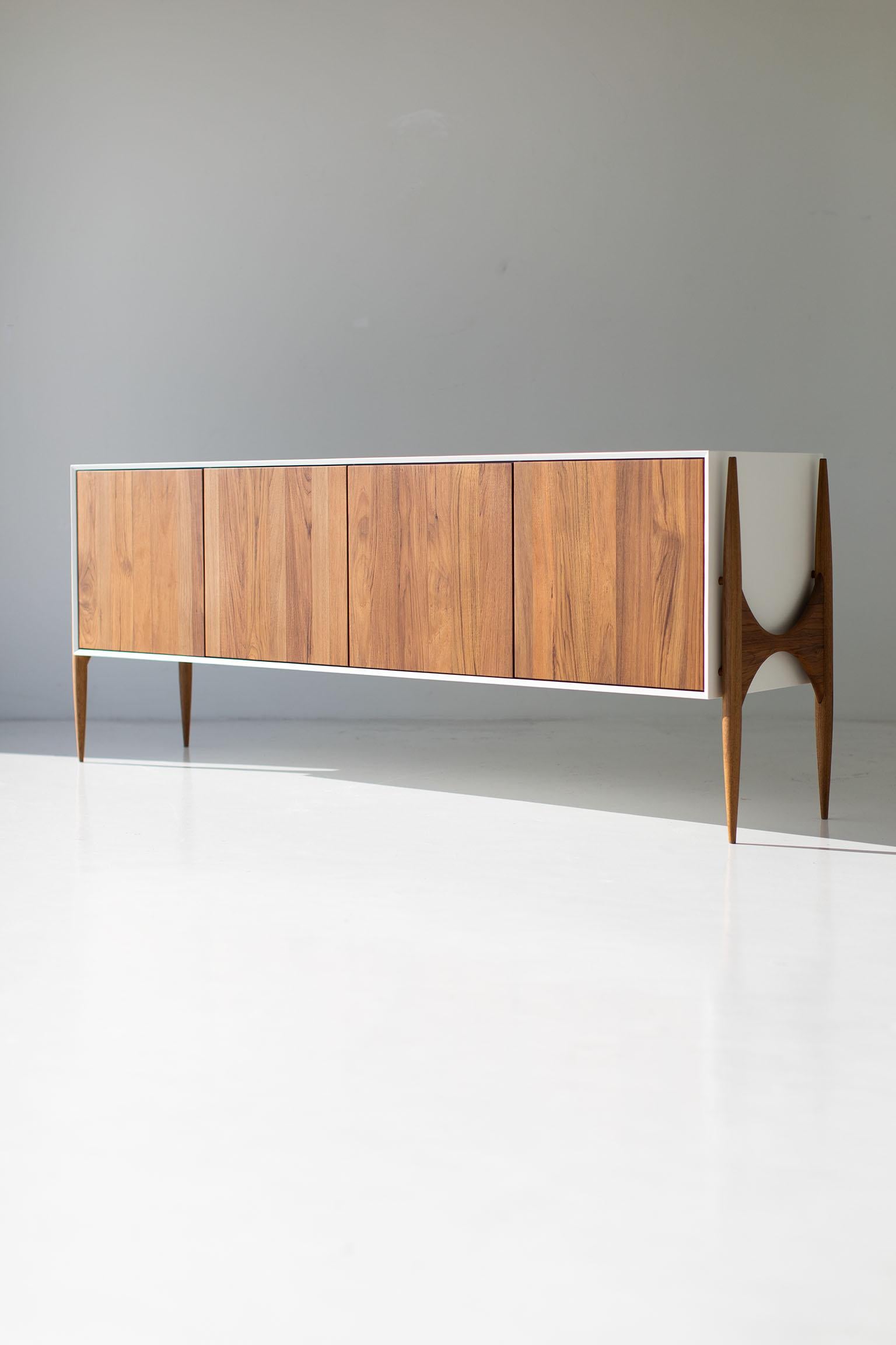 CraftAssociates Sideboard, Cambre Modern Teak Sideboard 

This modern teak credenza from the Cambre Collection for Craft Associates Furniture is expertly crafted. The legs and door fronts are constructed by artisans from solid teak. The frame is