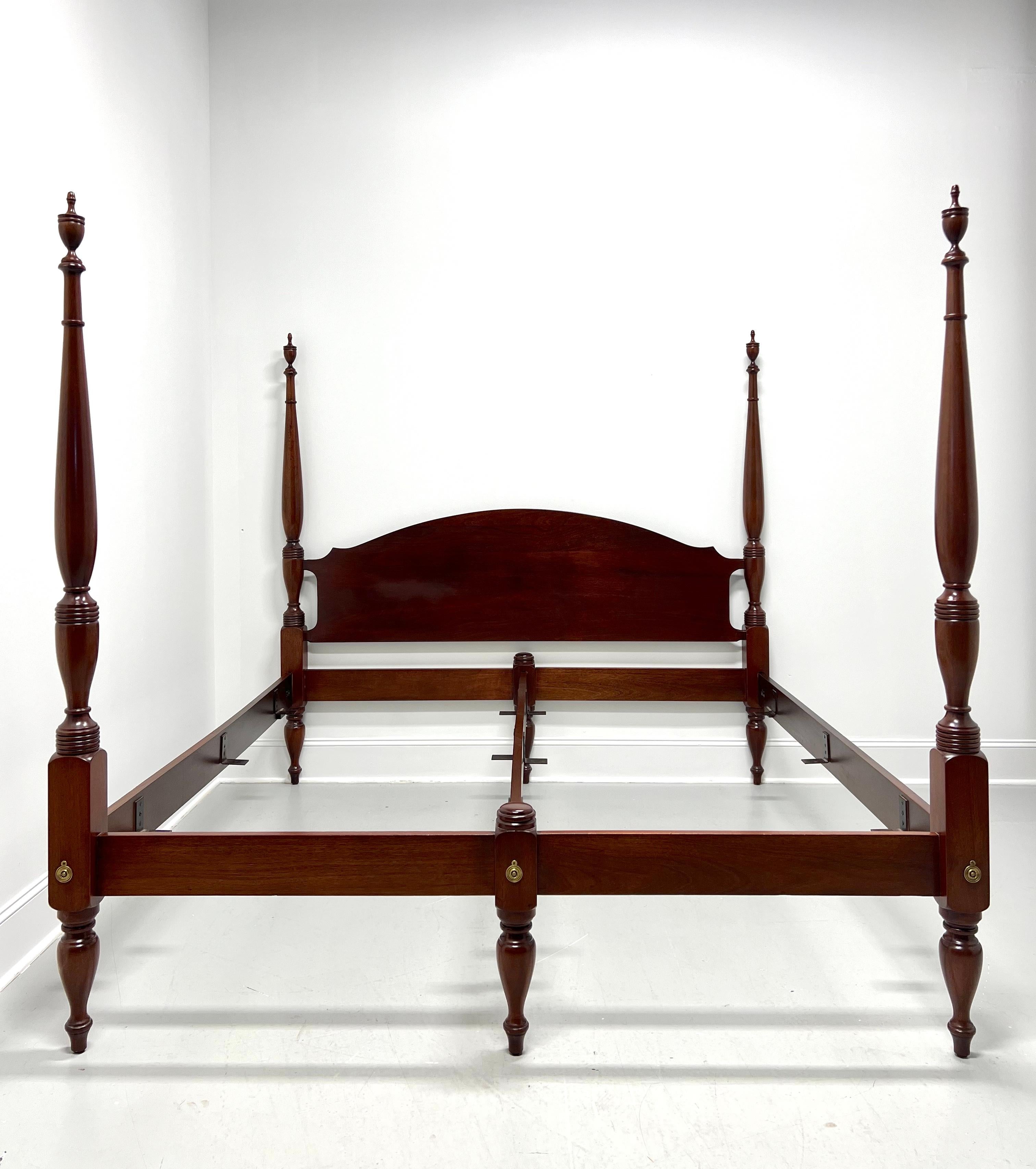 A Traditional style king size poster bed by high-quality furniture maker Craftique, their Ashlawn. Solid mahogany with an arched headboard, four decoratively turned plain posts with finials, two low decoratively capped posts at center, low rail