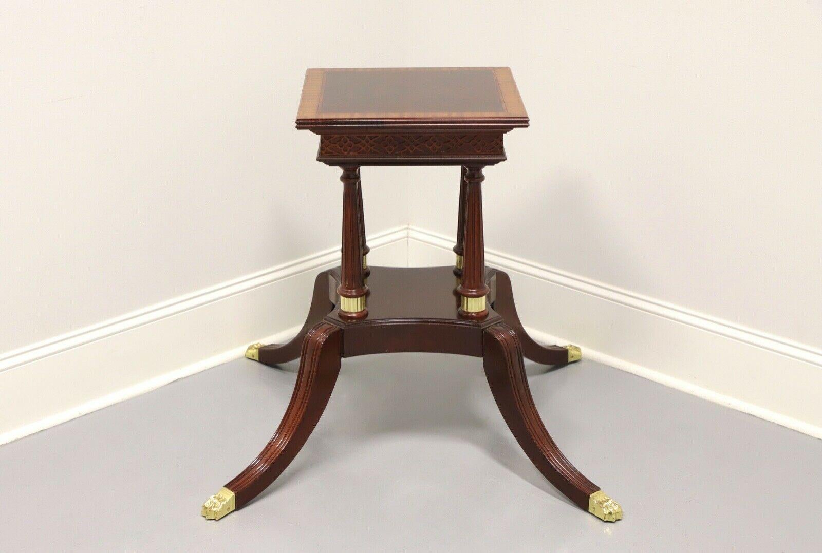 A Regency style table pedestal base by Craftique of Mebane, North Carolina, USA. Solid mahogany with banding on top. Birdcage pedestal of four fluted columns on square base plate supported by four sweep legs with brass toe caps. Ready for your style