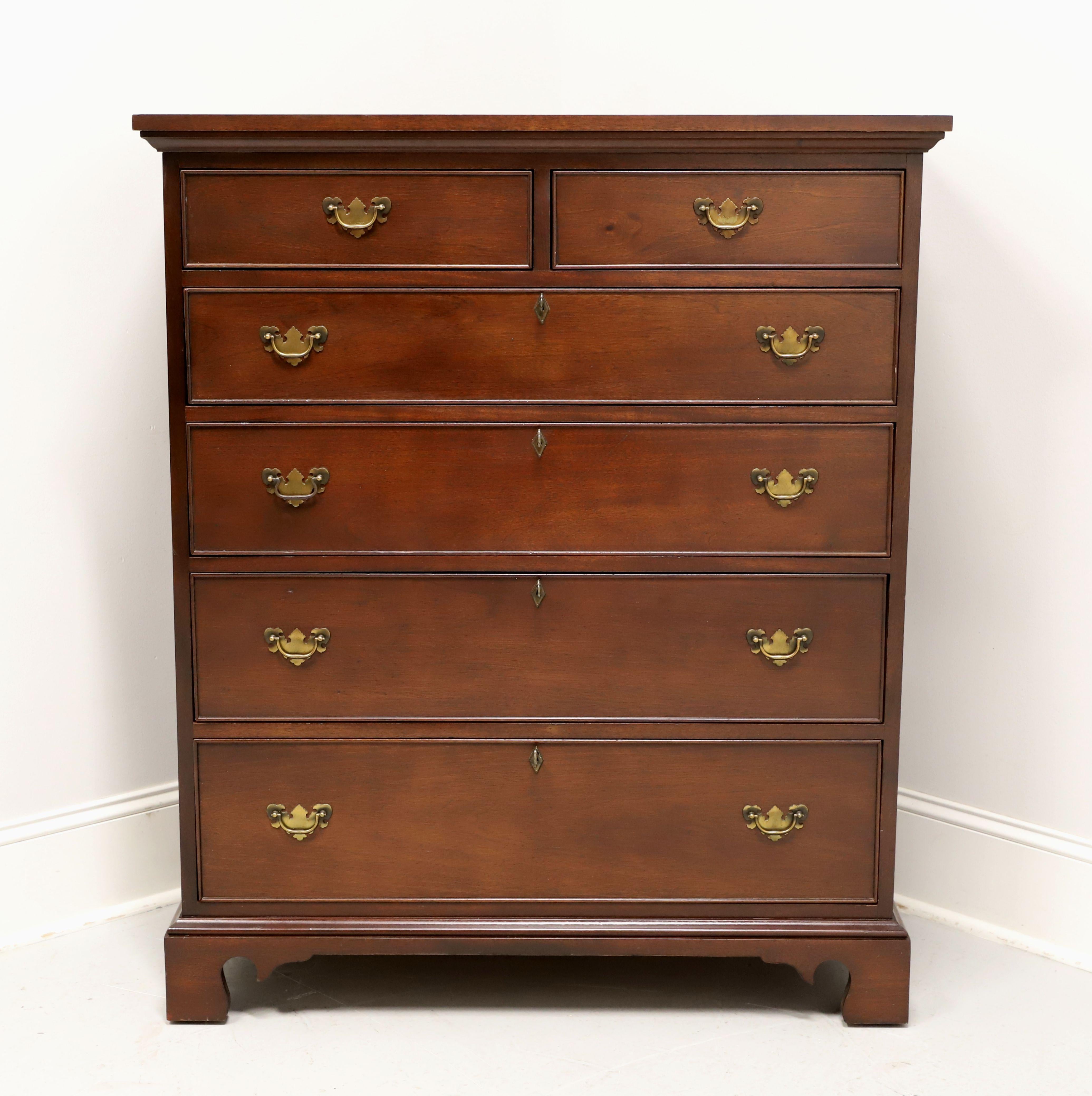 A Chippendale style chest of drawers by high-quality furniture maker Craftique. Solid mahogany with their Mellowax finish, brass hardware, miter edge to the top, brass keyhole escutcheons, and bracket feet. Features two smaller over four larger