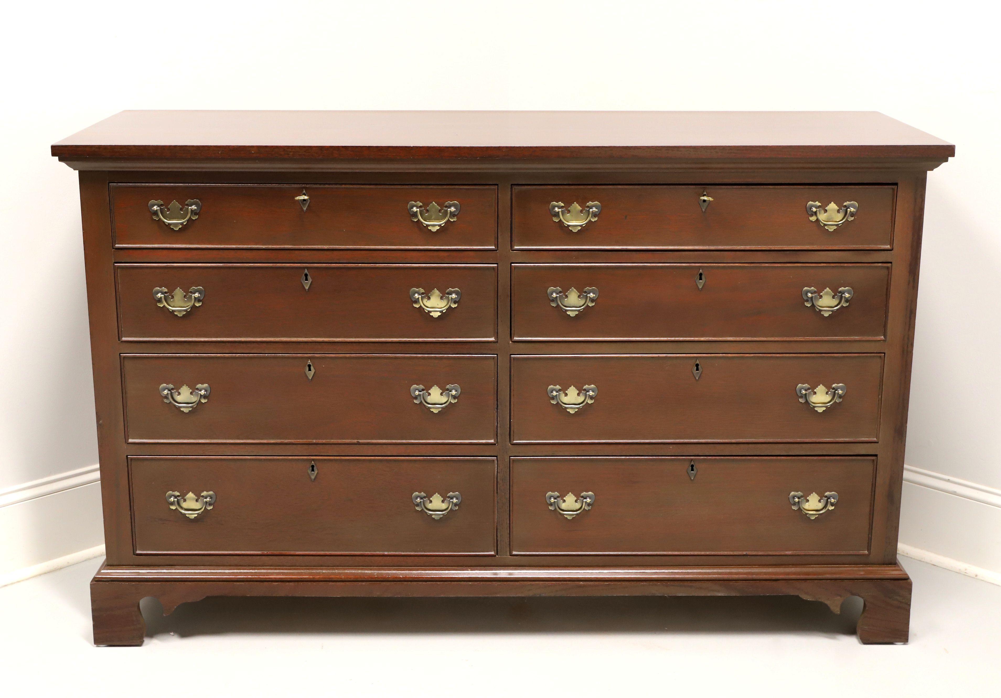 A Chippendale style double dresser by top-quality furniture maker Craftique. Solid mahogany with brass hardware, cockbeading to drawer fronts and bracket feet. Features eight various size lockable drawers of dovetail construction. Includes two keys.