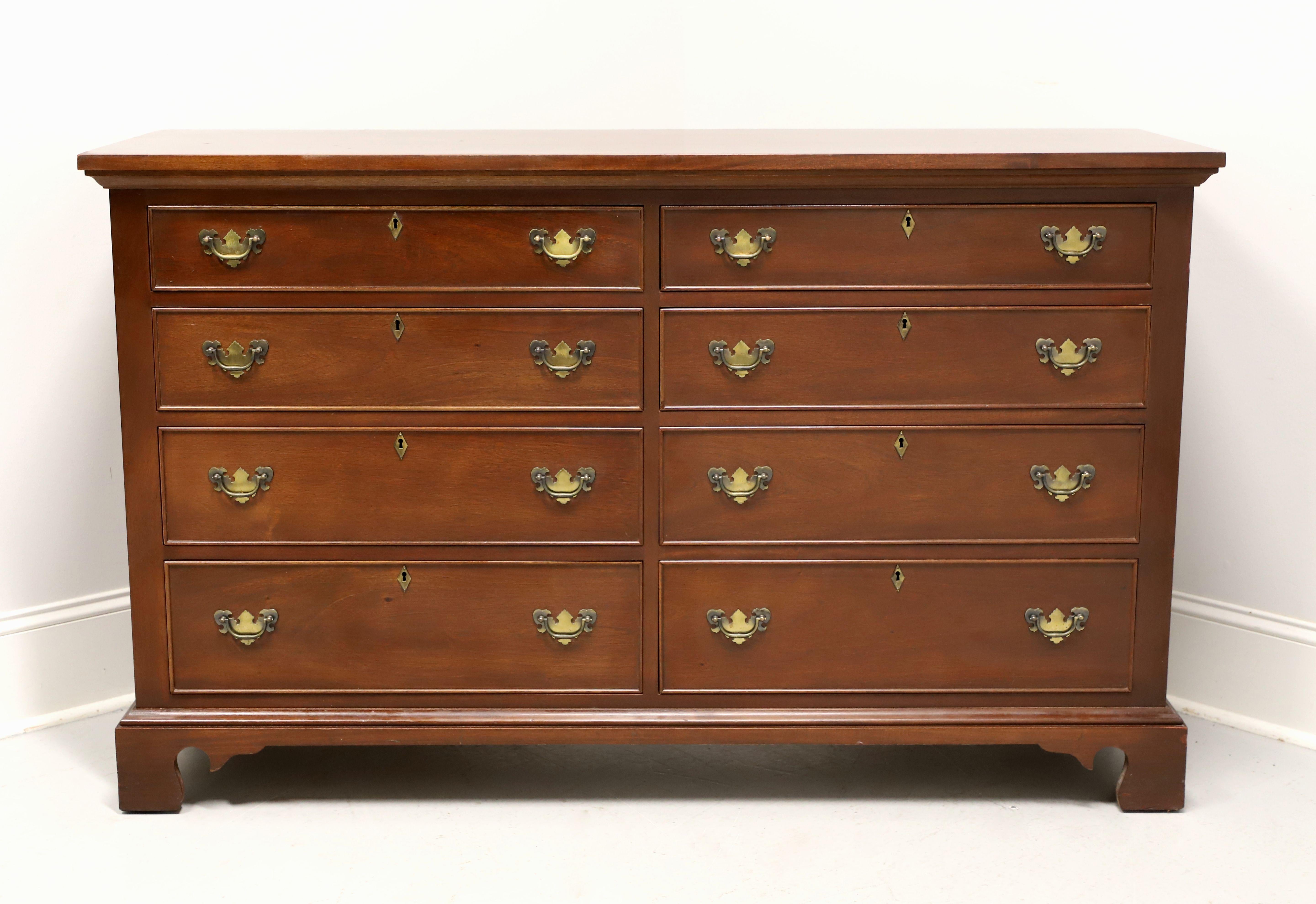 A Chippendale style double dresser by high-quality furniture maker Craftique. Solid mahogany with their Old Wood finish, brass hardware, solid edge to the top, cockbeading to drawer fronts, and bracket feet. Features eight various size lockable