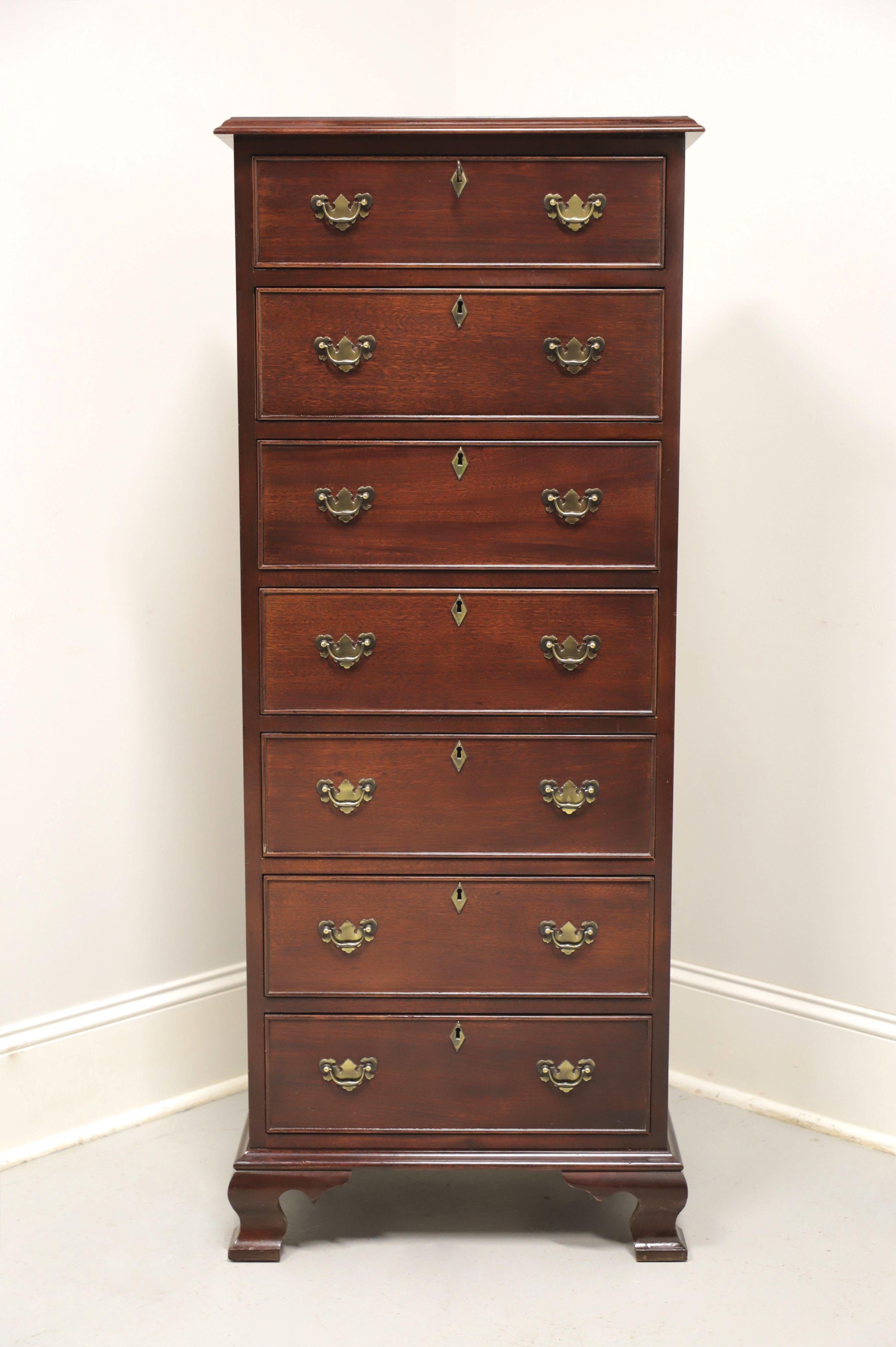 A lingerie chest in the Chippendale style by top-quality furniture maker Craftique. Solid mahogany with brass hardware, ogee edge to the top, and ogee bracket feet. Features seven drawers of dovetail construction, all of which are lockable. Includes