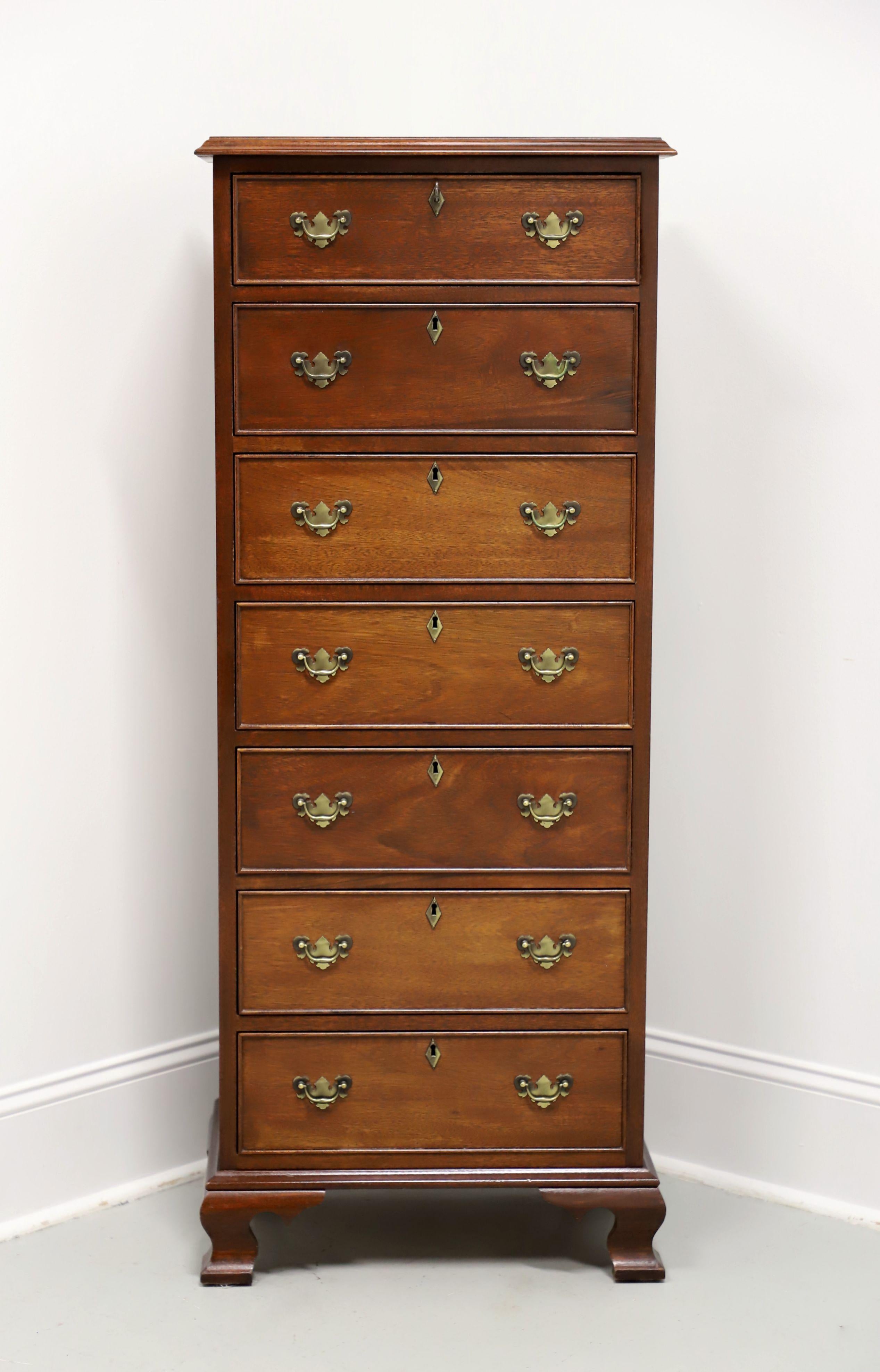 A lingerie chest in the Chippendale style by high-quality furniture maker Craftique. Solid mahogany with their Old Wood finish, brass hardware, ogee edge to the top, brass keyhole escutcheons, and ogee bracket feet. Features seven drawers of