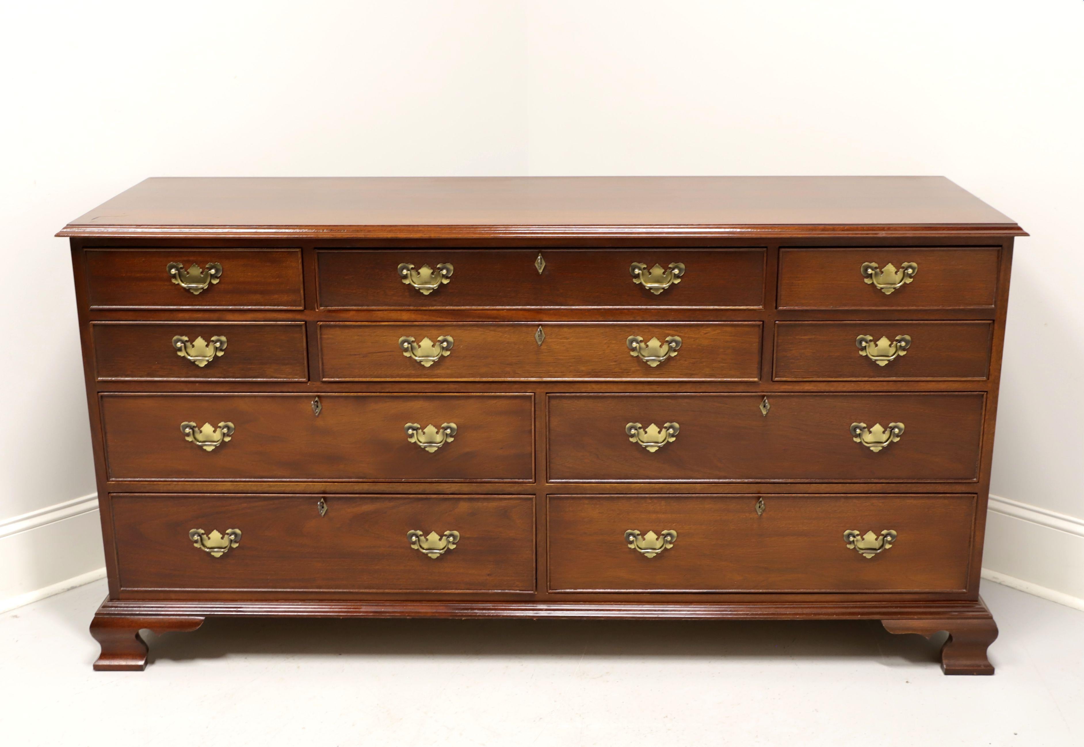 A Chippendale style dresser by top-quality furniture maker Craftique. Solid mahogany with brass hardware and ogee bracket feet. Ten various size drawers of dovetail construction, six of which are lockable. Includes six keys. Made in Mebane, North