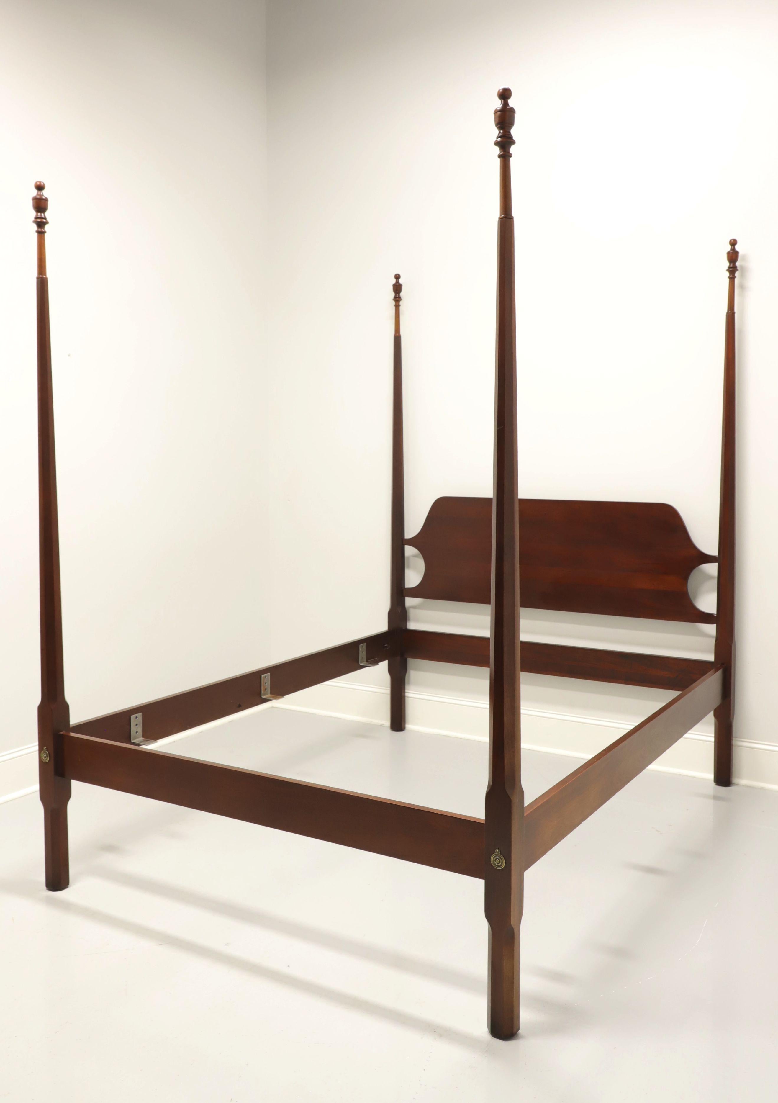 A Traditional style queen size pencil post bed with canopy by Craftique. Solid mahogany with four pencil like posts capped by finials, an open wood slat canopy, bolt held side rails with metal mattress supports, brass hardware, and finial extenders