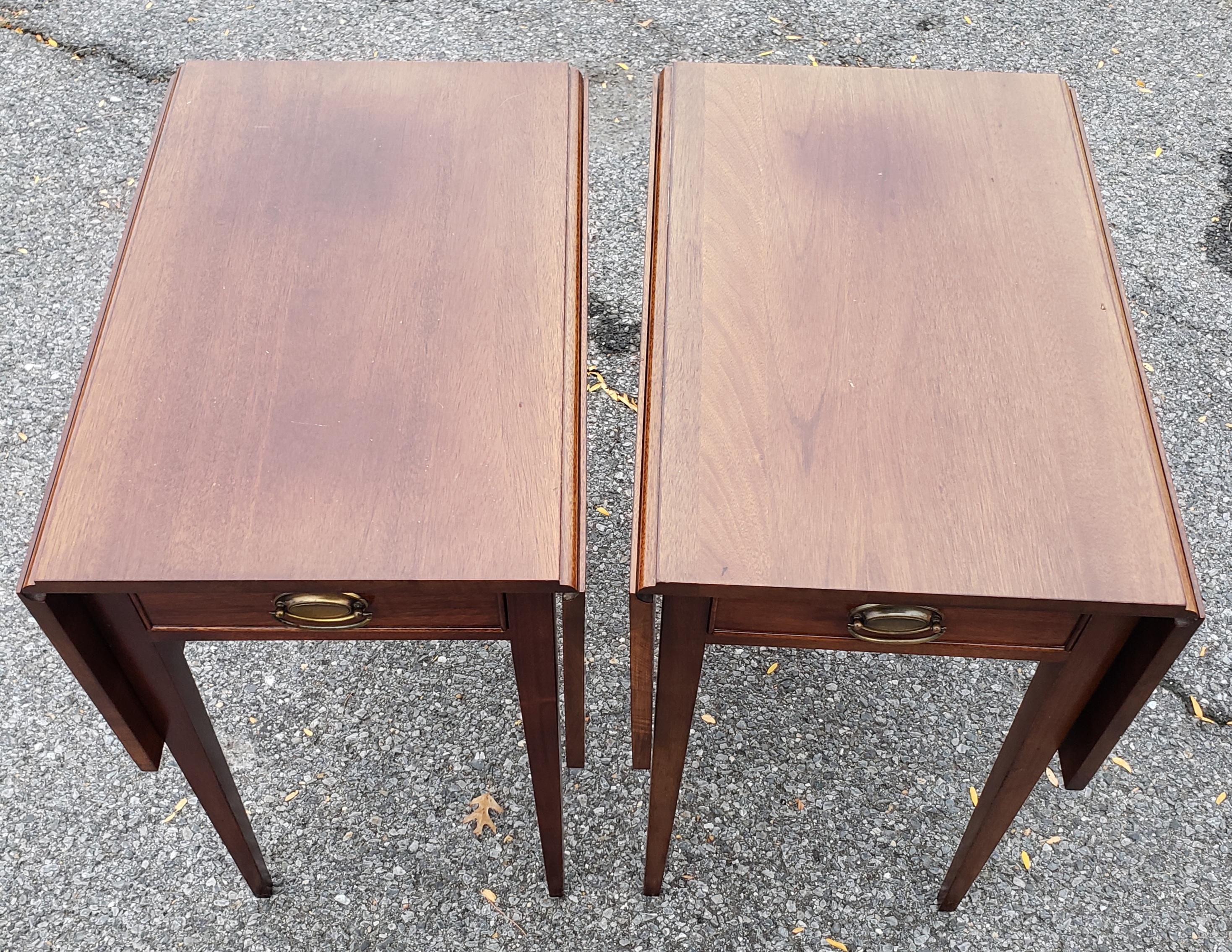 Matched pair of heirloom quality Pinckney Pembroke side tables by the Craftique Furniture Company of Mebane, North Carolina.Craftique was in existence from 1946-2012 and throughout was recognized as the nation's leading maker of heirloom quality