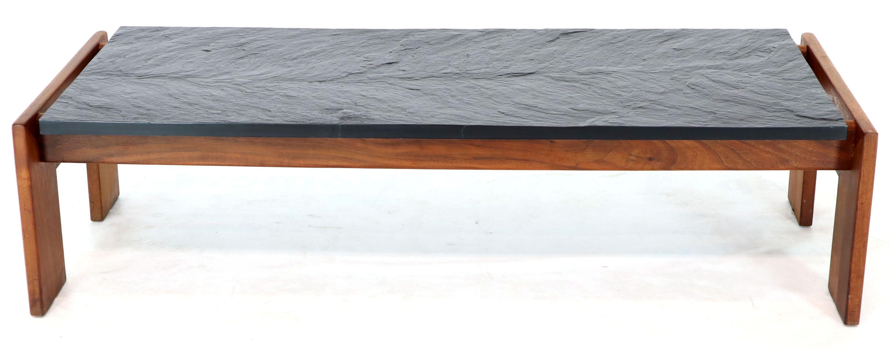Mid-Century Modern oiled walnut base slate top long rectangel shape coffee table by Adrain Pearsall. The table is a good match to 