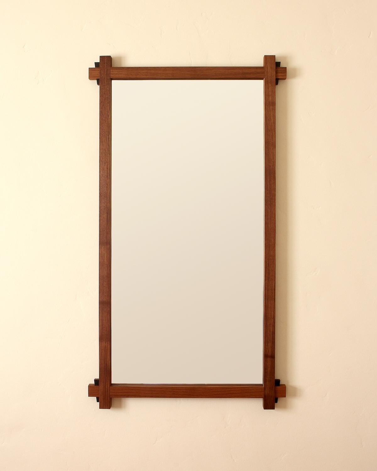 Made to order solid black walnut frame with black granite wedge details. Hand cut solid wood joinery in the style of the 