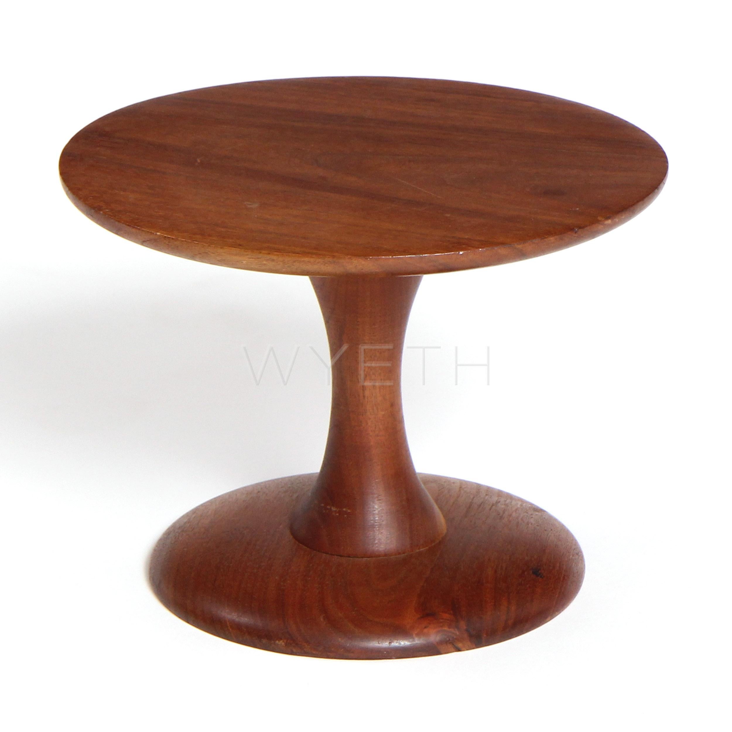 A small walnut turned pedestal or children's stool.