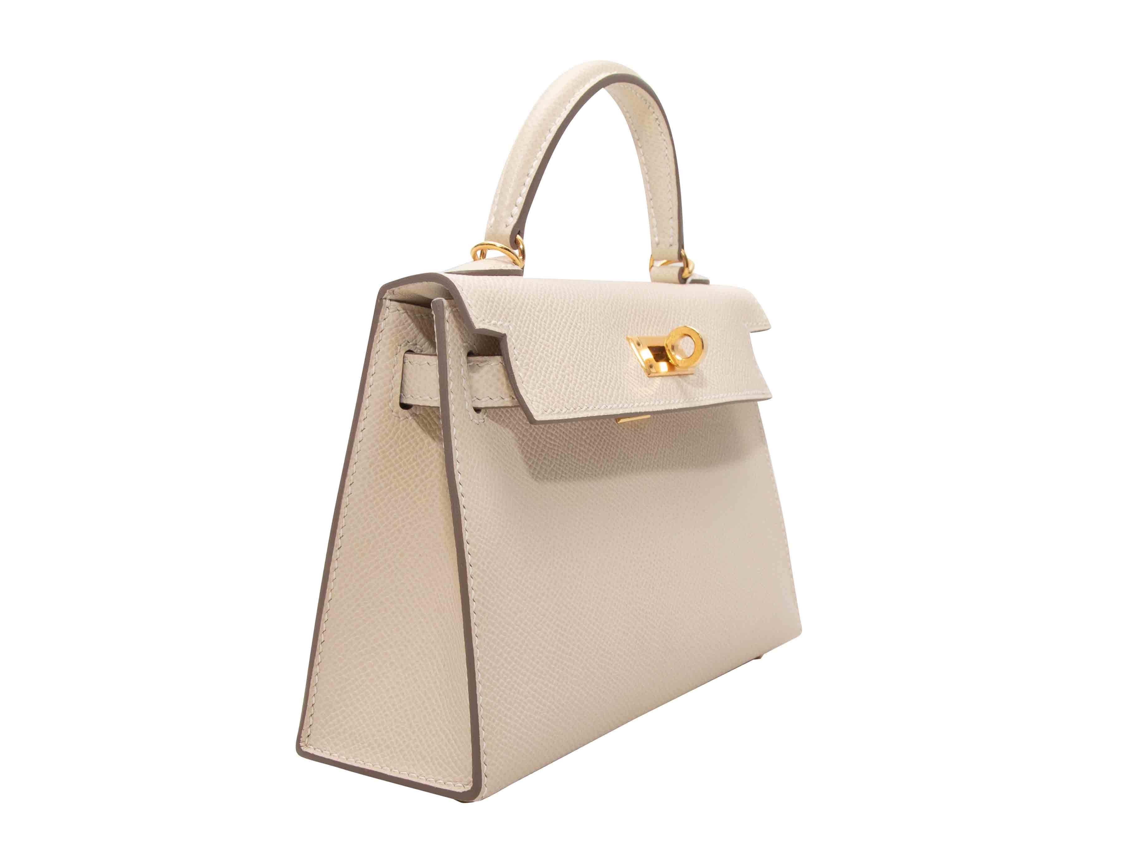 Craie Hermes Mini Kelly II. La Mini Kelly II ha un corpo in pelle, finiture dorate, un unico manico superiore, un'unica tracolla e una chiusura frontale a girello. L. 7,5
