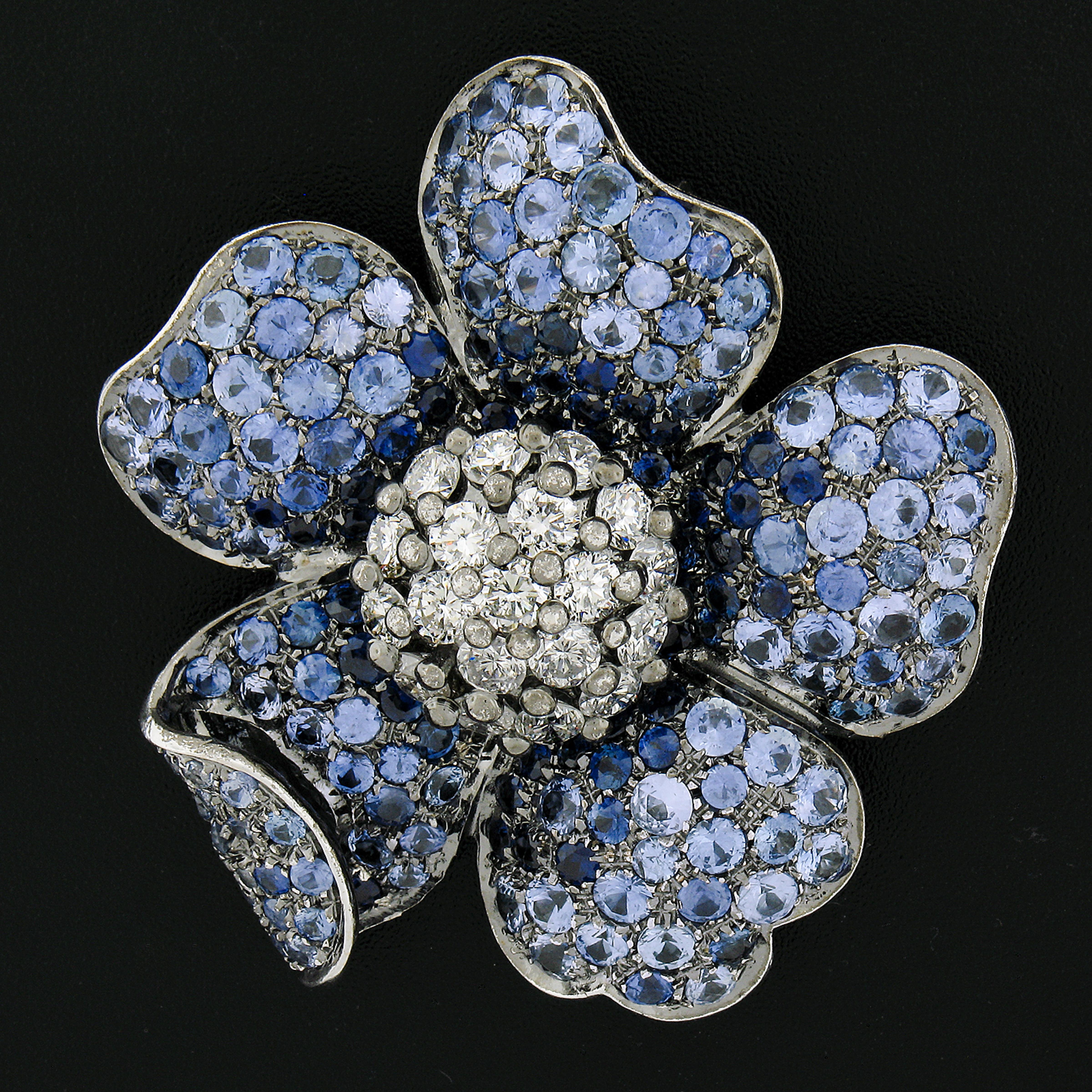 --Stone(s):--
Numerous Natural Genuine Sapphires - Round Brilliant Cut - Pave Set - Very Nice Graduated Color Light to Dark Blue Color - 14ctw (approx.)
(19) Natural Genuine Diamonds - Round Brilliant Cut - Prong Set - G-I Color - VS1/VS2 w/ Few SI