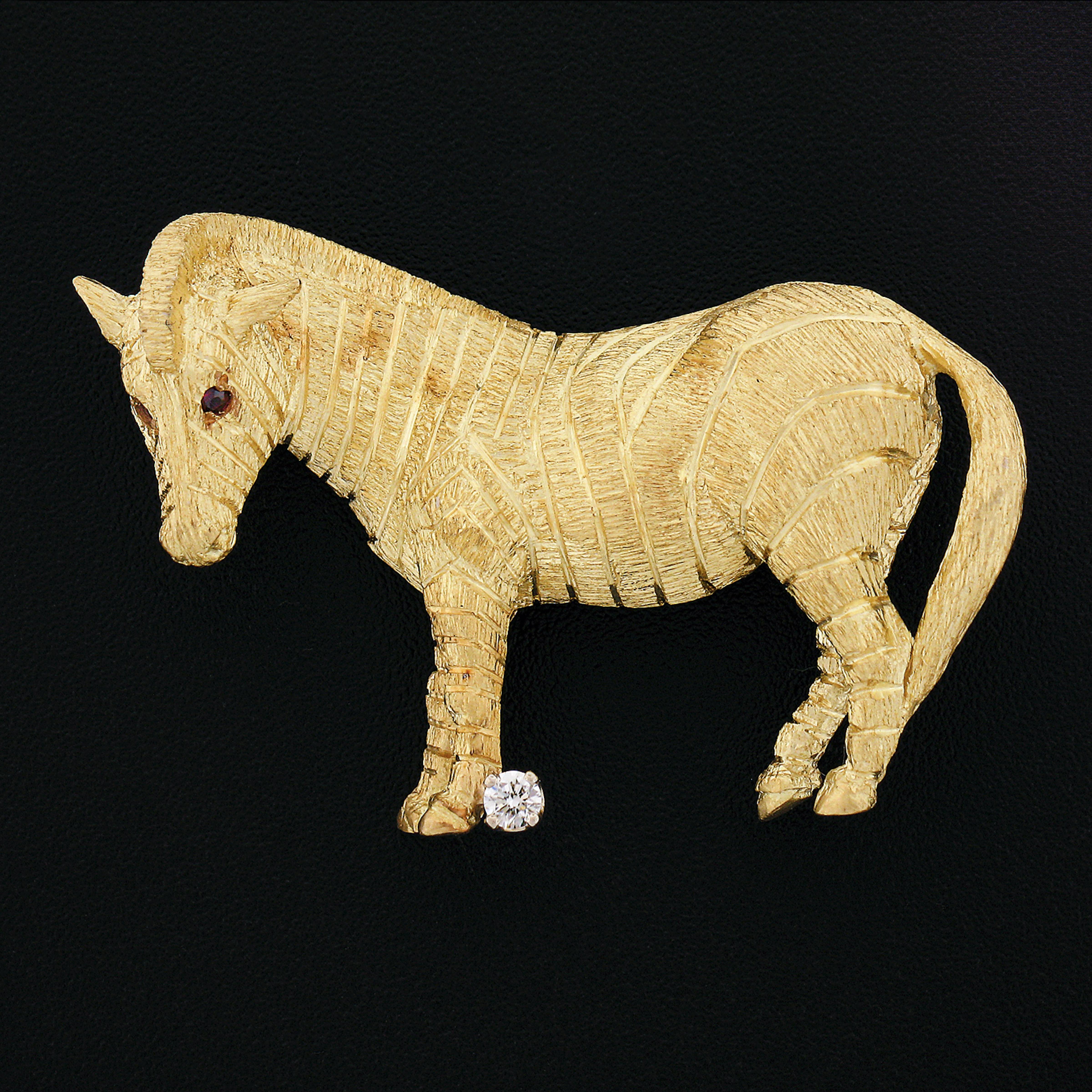 This incredible brooch/pin is designed by Craig Drake and very well crafted in solid 18k yellow gold. It features a perfectly structured standing zebra design with unique, and remarkably outstanding workmanship and texture throughout that bring out