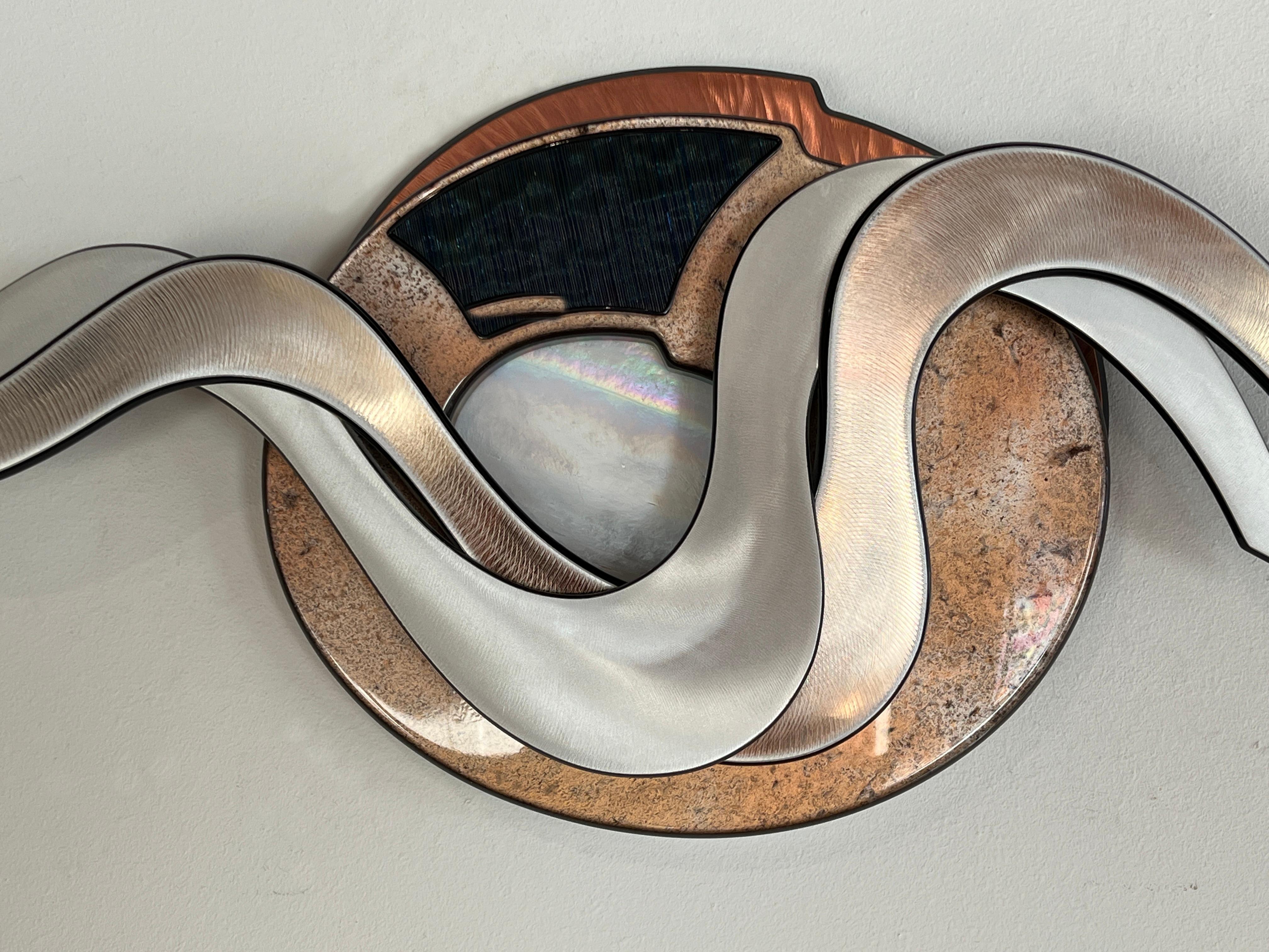Craig French is a contemporary pop-Constructivist sculptor, whose brilliant, lyrical wall pieces have gained an international audience. Cast resins, acrylics, sheet metals, rare woods, and glass are laboriously cut, lathed, and polished into