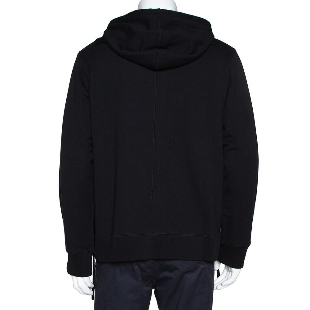 This hoodie by Craig Green is a great pick for a relaxed day. It is crafted from a cotton blend to keep you comfortable. It features long sleeves, zip closure and four pockets. The hoodie is a minimal style statement and an example of exquisitely