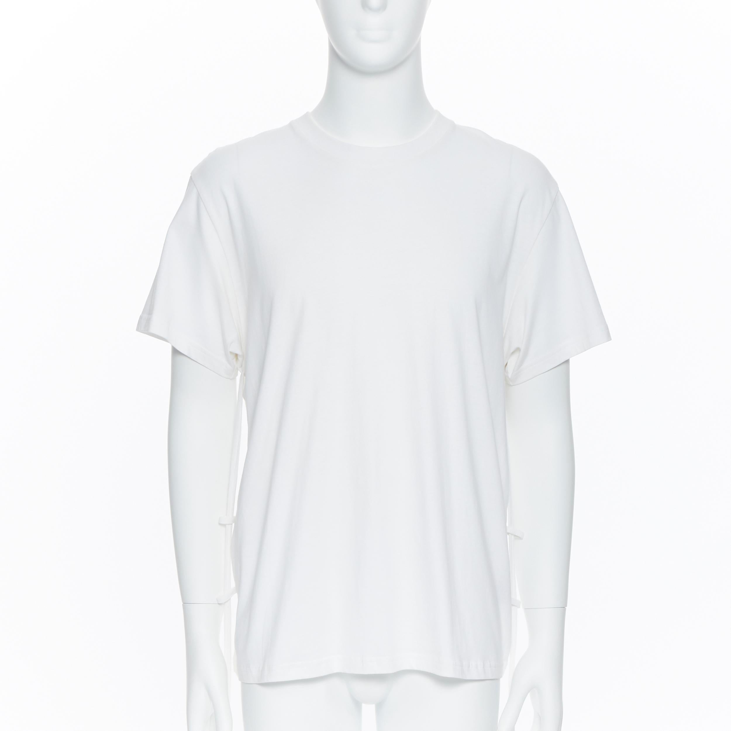 CRAIG GREEN white cotton weighed drawstring strap short sleeve t-shirt top M
Brand: Craig Green
Designer: Craig Green
Model Name / Style: T-shirt
Material: Cotton
Color: White
Pattern: Solid
Extra Detail: Short sleeve. Crew neck neckline.
Made in: