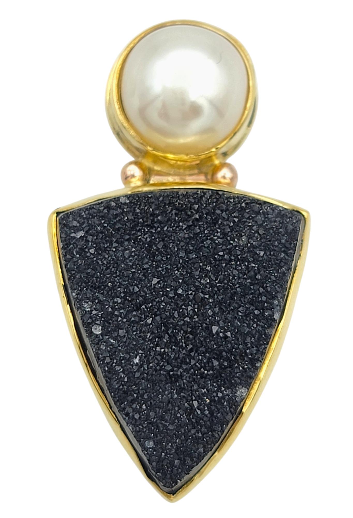 Add a bold touch of sophistication to your collection with these amazing Craig Hagstrom black druzy agate and pearl earrings. Meticulously crafted in radiant 18 karat yellow gold, these earrings feature striking triangle-shaped black druzy agates
