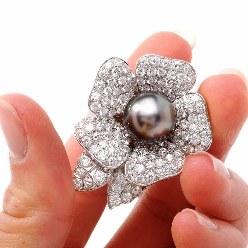 This exquisite piece from Craiger Drake designer is finely crafted in solid 18K white gold. It is centered with a genuine black South Sea Pearl, approx. 14mm in diameter and is accented with some 125 genuine high quality round cut diamonds approx.