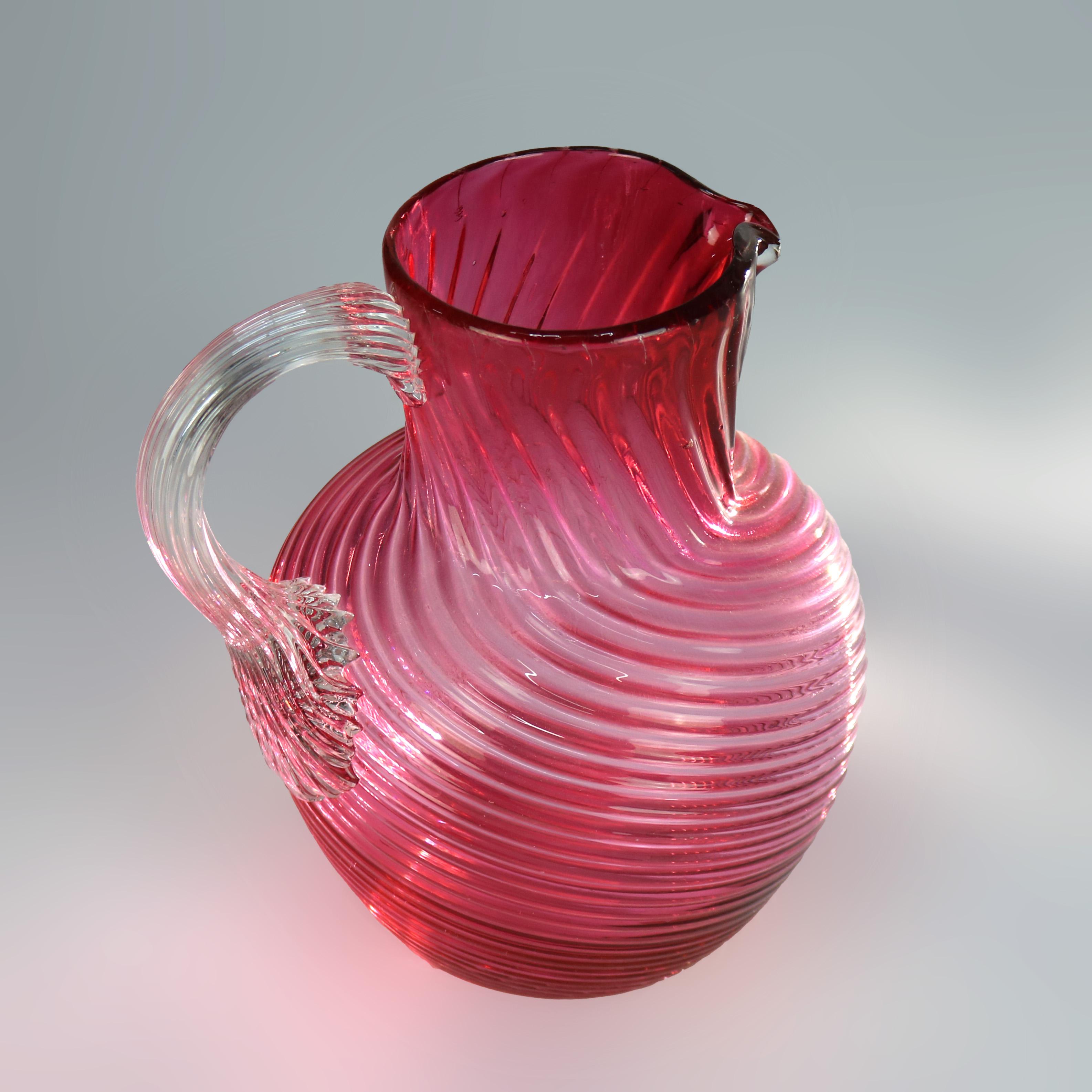 Cranberry Swirl Glass Water Pitcher with Applied Glass Handle 20thC

Measures - 8.5