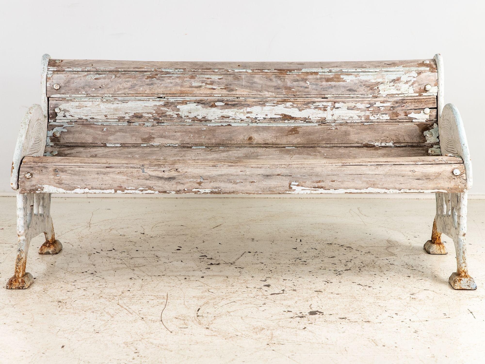 Originally made for the Colchester Zoo in England, this garden bench is a delightful piece of outdoor furniture with a charming Crane bird design. The bench features a sturdy wooden seat and backrest that provide comfortable seating. The bench's