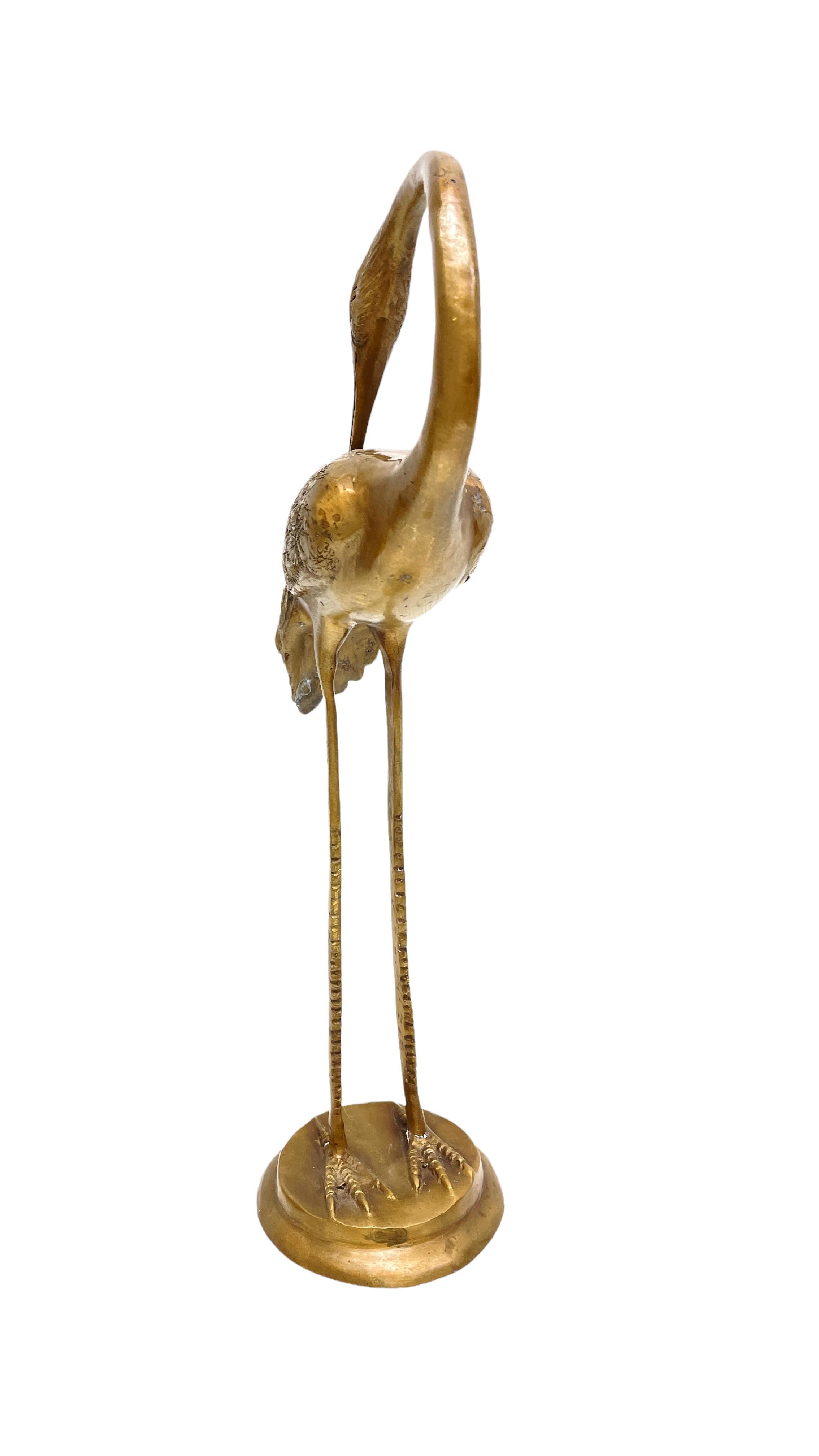 A beautiful vintage brass crane or heron statue. This decorative item would make a beautiful addition to any room. Made in the 1960s it displays the joy of that great era with a bold, yet classy statement.