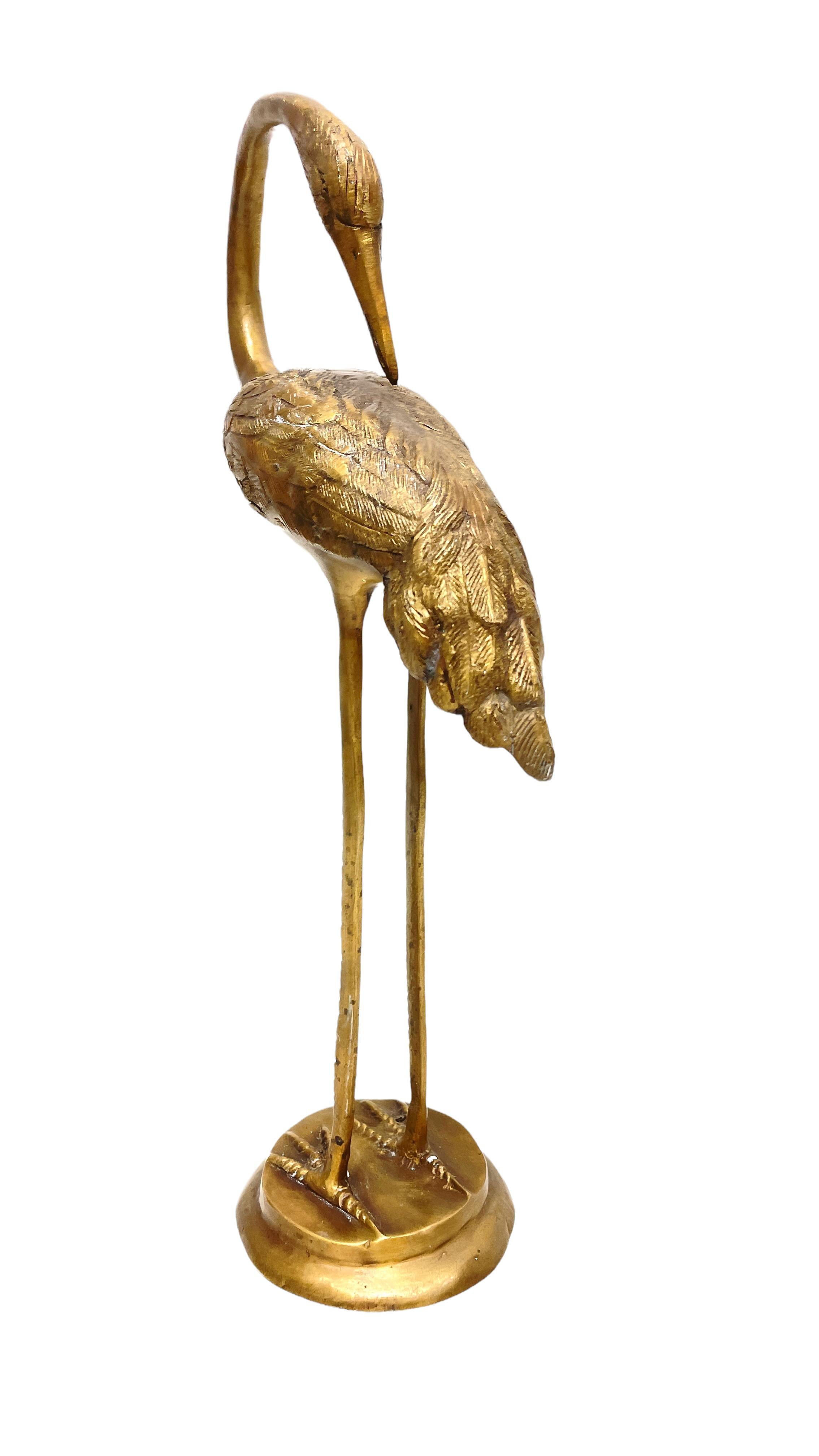 brass heron statues