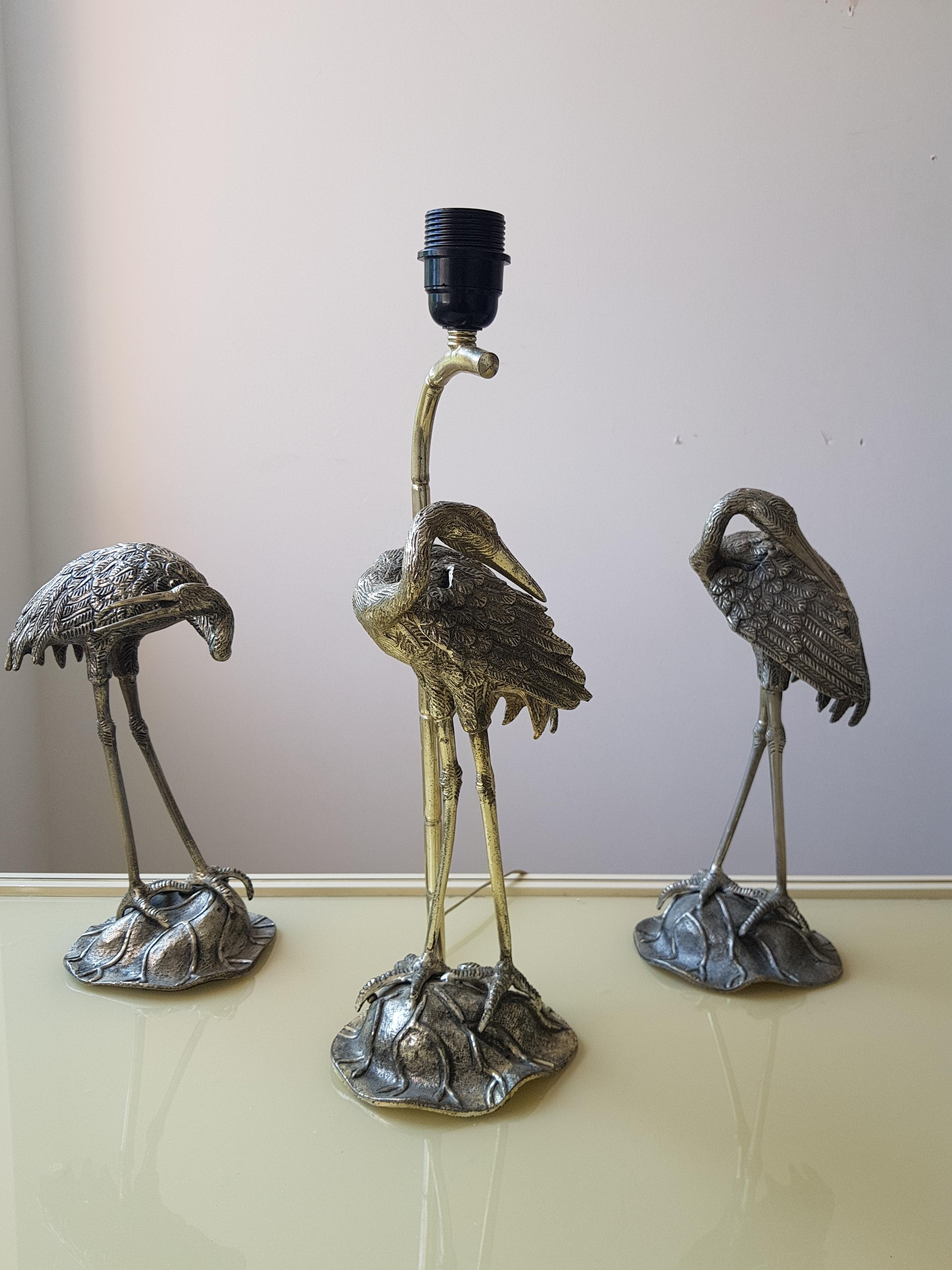 Silver plated crane table lamp with two statues by Maison Jansen.
The lamp is very detailed with a silver plated bamboo stick, this Maison Jansen comes with two Maison Jansen silver plated statues.

Measures: 34cm height for the statues, 44 cm in