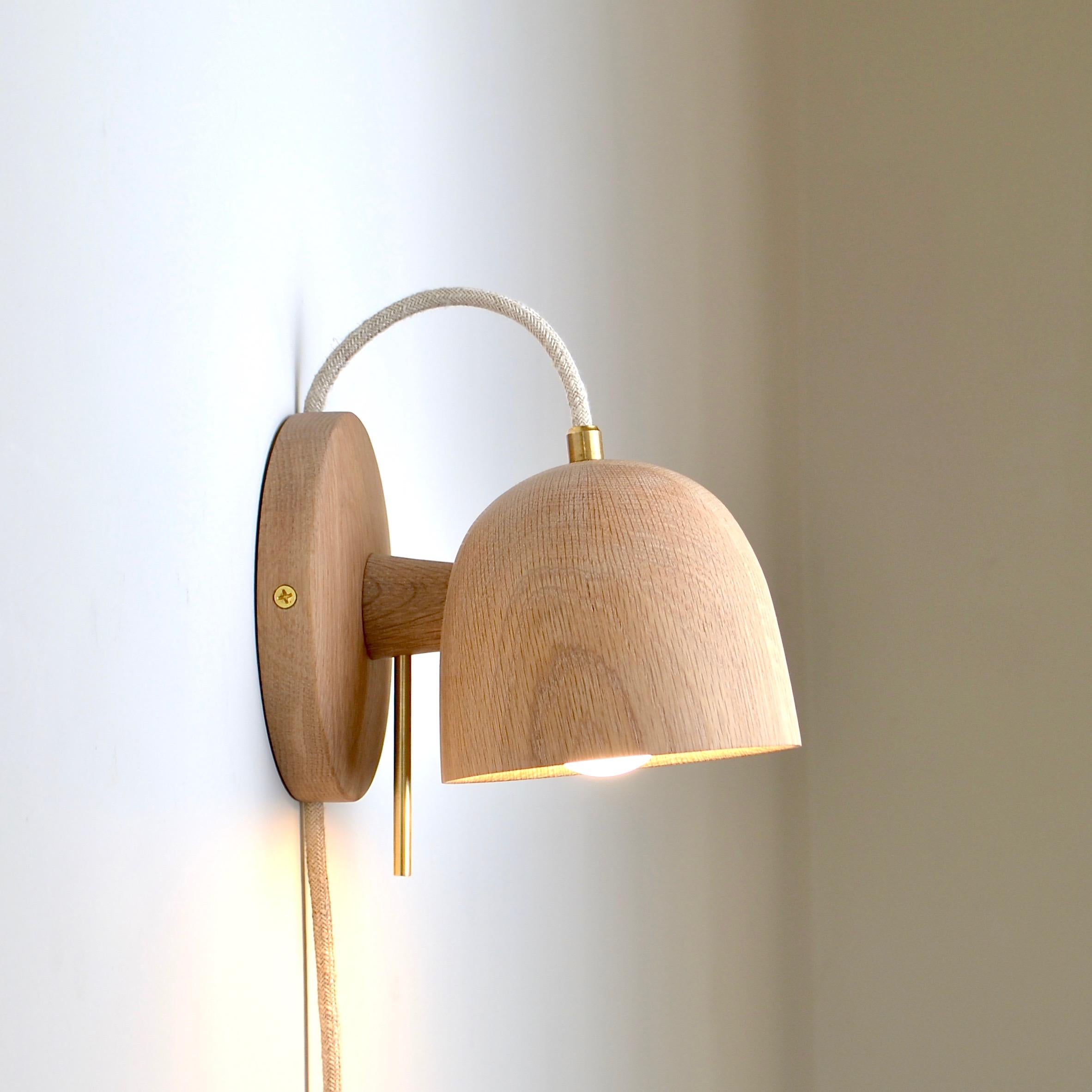 The latest addition to our popular Crane Lamp family. This compact sconce will illuminate any room of the house, from bathroom to bedside. The lamp’s simple and well-proportioned design is contemporary, yet solid wood adds warmth to the piece. The