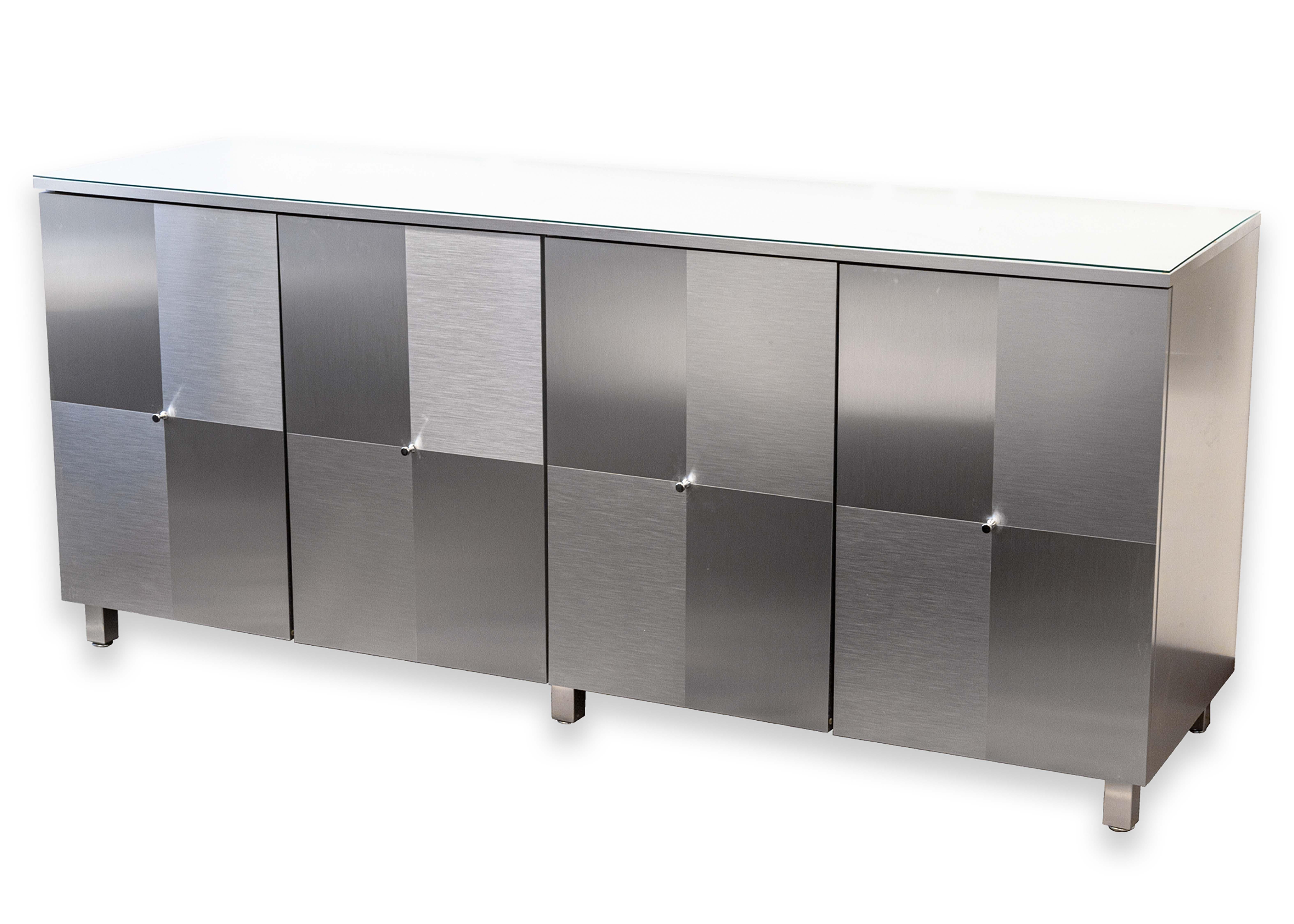 A Cranium Calais buffet credenza. This wonderful contemporary modern piece of furniture takes heavy influence from the classic design language of Ello furniture. This rectangular buffet style credenza features a four door front with checkered satin