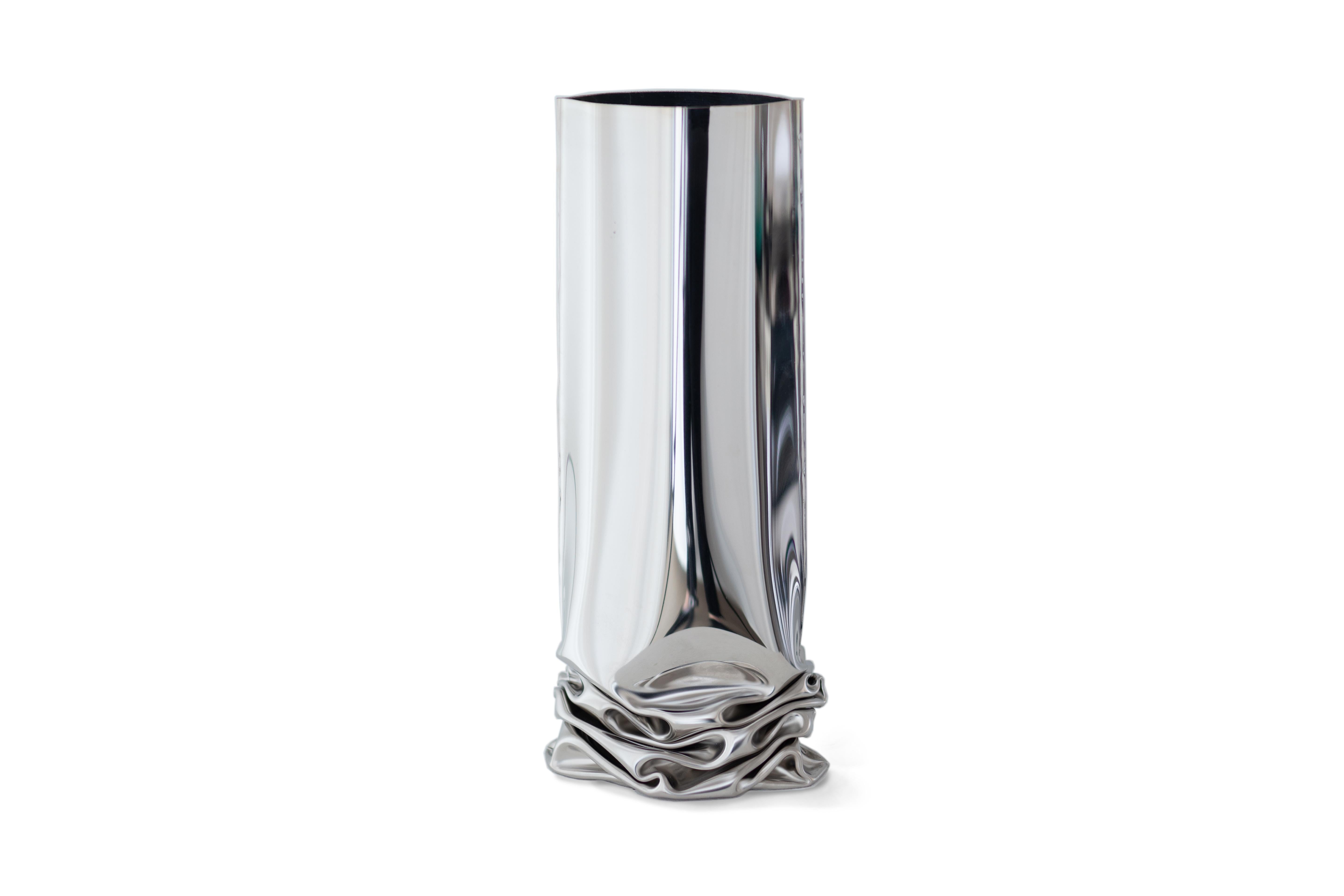 Crash vase 1 by Zieta
Dimensions: H 30 x W 13.5 x D 20 cm.
Materials: polished stainless steel.

Unobtrusive deformation Crash Vases reflect the “controlled loss of control” technique. The vases embrace the notion of deformation.
Grouped
