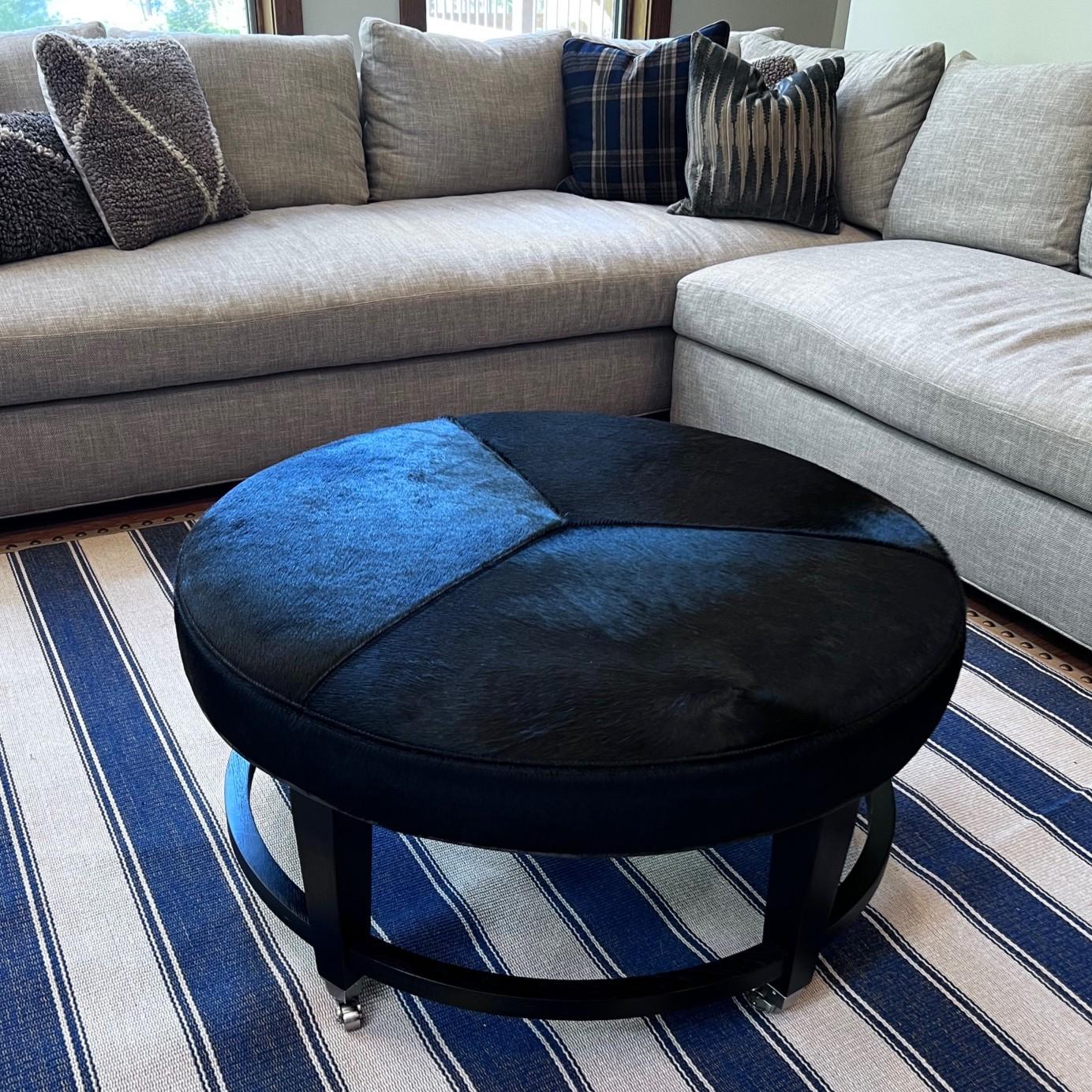Crate & Barrel Round Hair-on-Hide Ottoman with Chrome Casters, Modernist Style, USA, 2017

This striking round ottoman, made in 2017 for Crate & Barrel, reflects the clean lines and functional elegance of Mid-Century Modern and contemporary design.