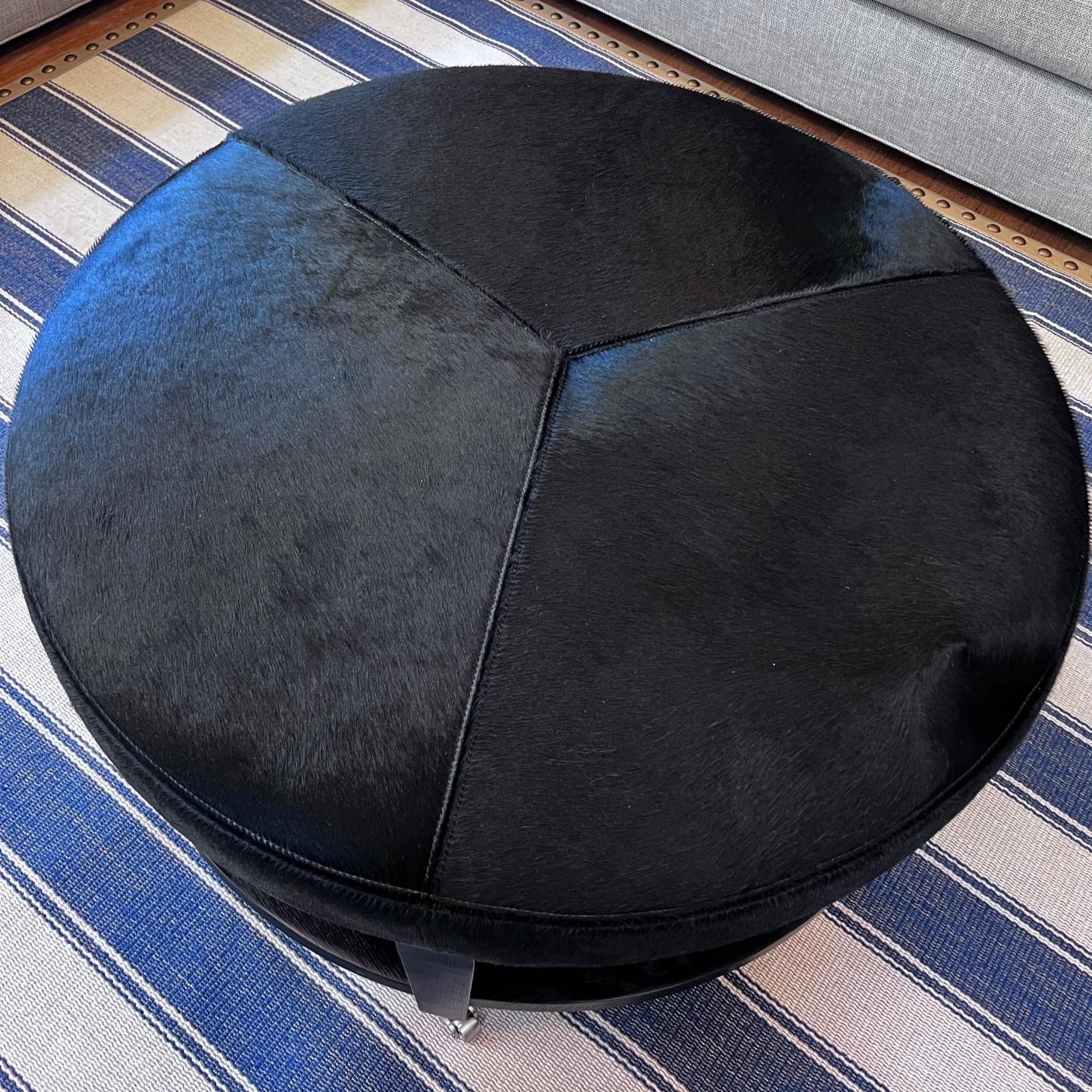 American Crate & Barrel Round Hair-on-Hide Ottoman with Chrome Casters, Modernist Style For Sale