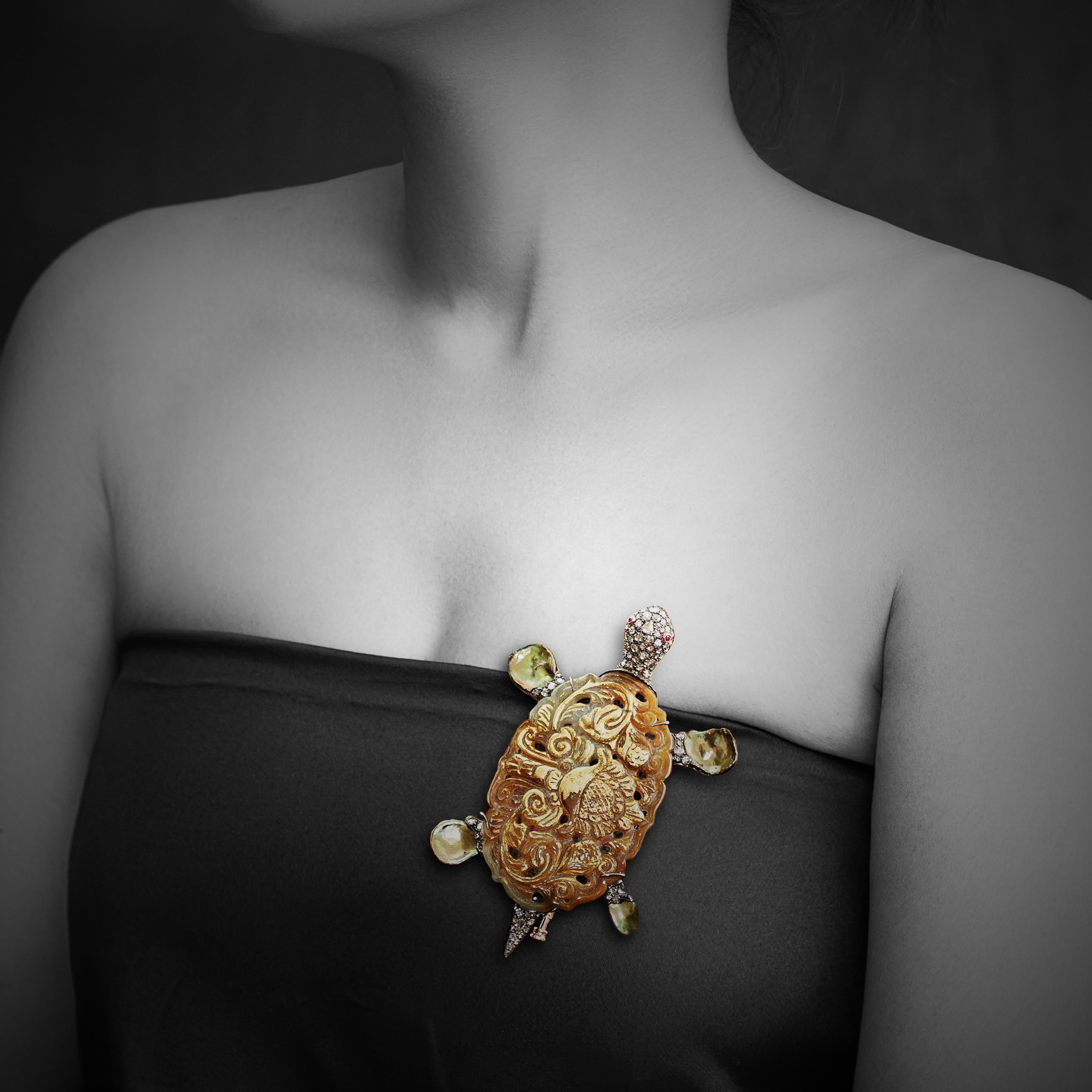We dedicated this beautiful brooch to the wonder and beauty of sea turtles. This turtle brooch is combined with carved jade, keshi pearls, white rose-cut diamonds and rubies in the eyes. 
Designed to protect and preserve endangered sea turtle for