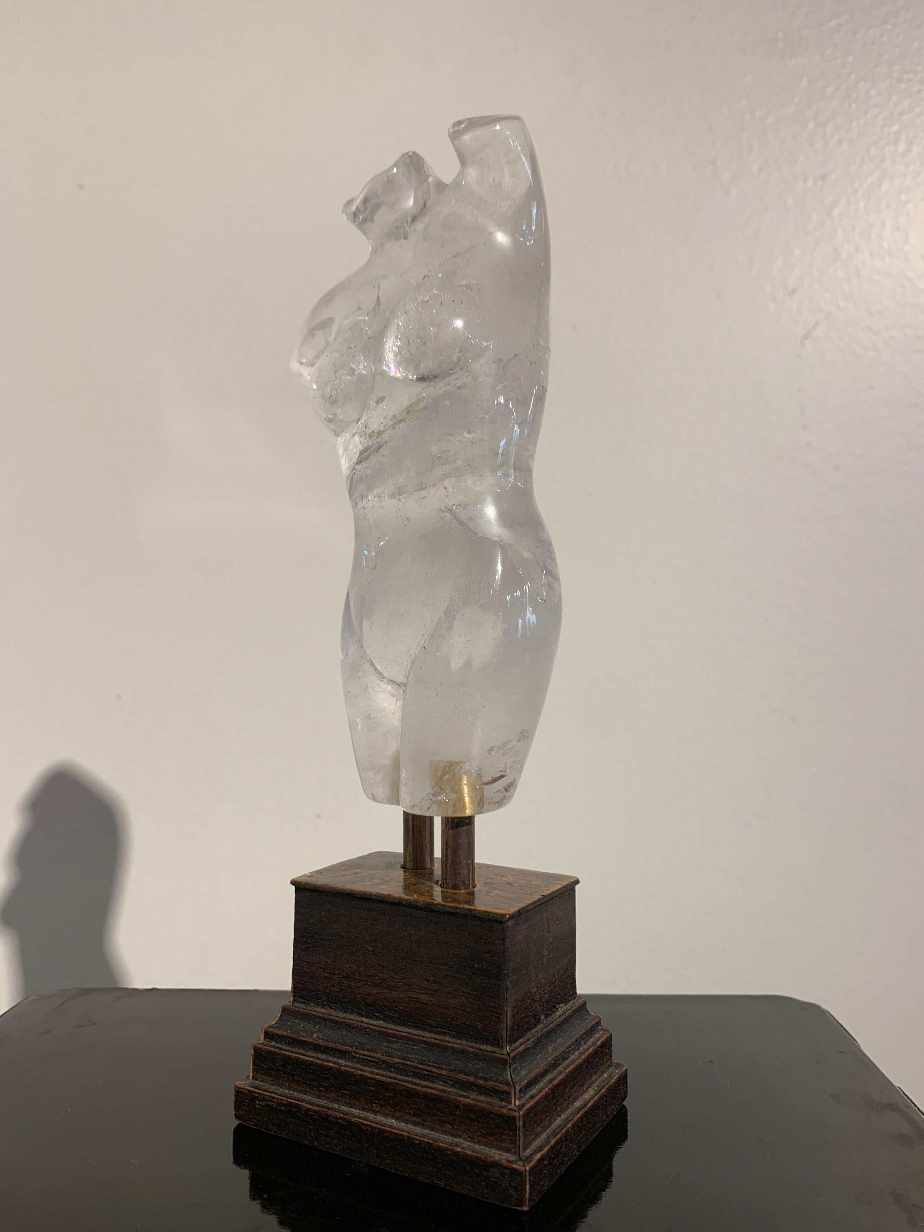A beautiful carved and polished small rock crystal figure of Venus, probably Italy, carved after the antique, early to mid-20th century.

The naked torso, almost certainly depicting Venus, the goddess of love and beauty, features a voluptuous