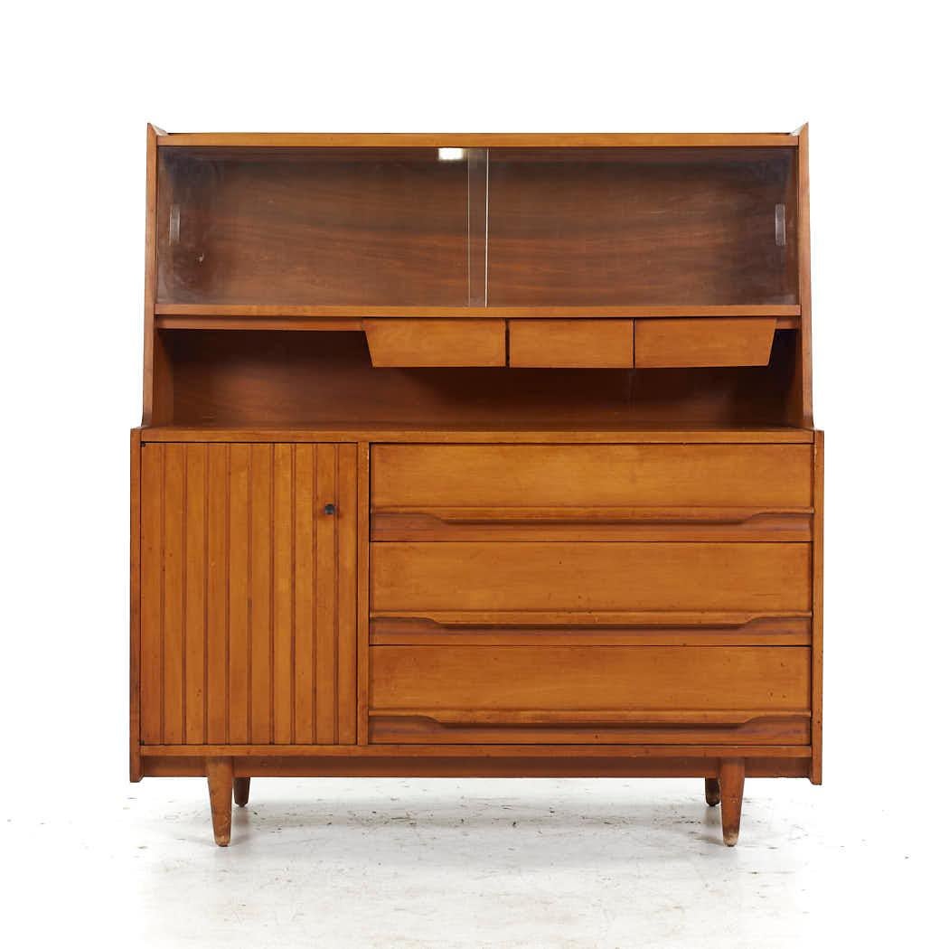 Crawford Furniture Mid Century Maple China Cabinet

This china cabinet measures: 48 wide x 19.25 deep x 51.5 inches high

All pieces of furniture can be had in what we call restored vintage condition. That means the piece is restored upon purchase