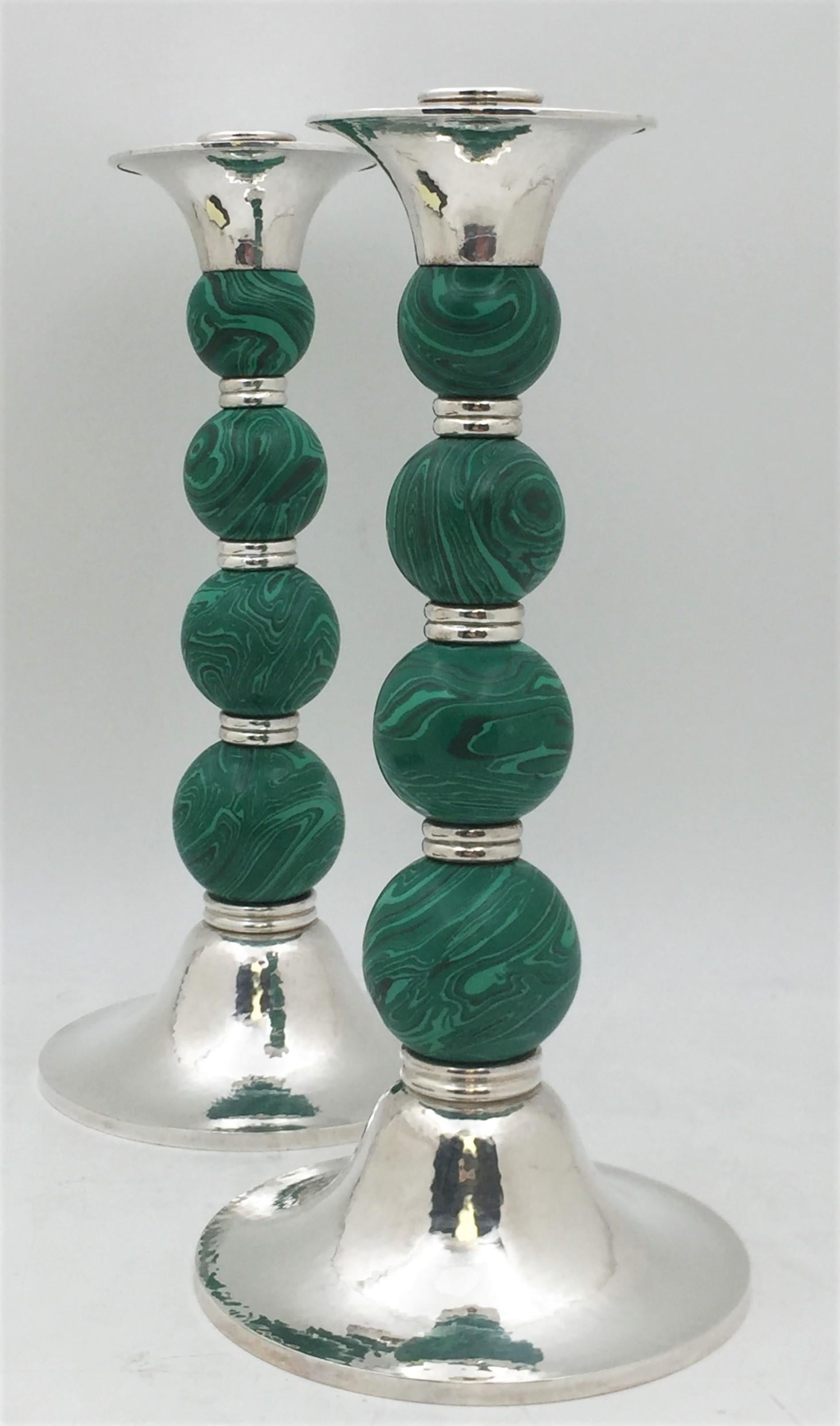 English pair of hand-hammered sterling silver and malachite candlesticks by acclaimed silversmith Crawford. These elegant and well-proportioned candlesticks in Mid-Century Modern style measure 11 3/4'' in height by 5 1/2'' in diameter at the base