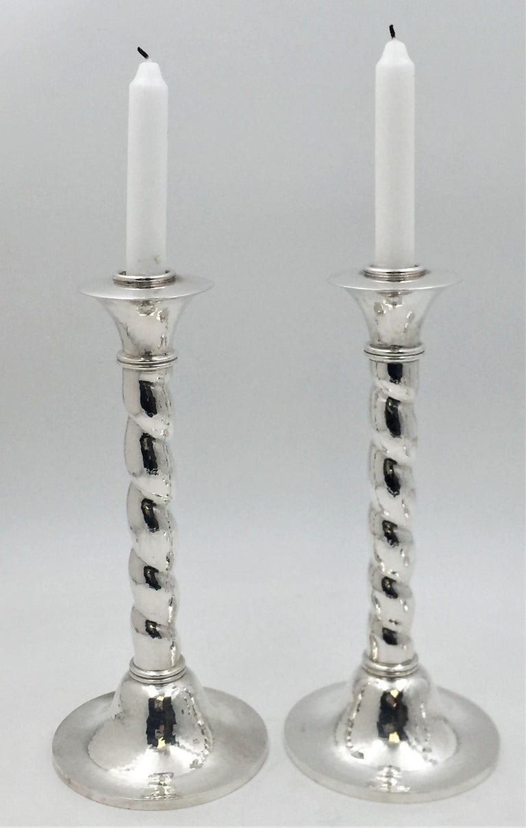 Alastair Crawford, English, sterling silver, beautifully hand-hammered set of 4 candlesticks in Mid-Century Modern style with twisted body form. Each measures 10 1/8'' in height by 4 1/2'' in diameter at the base and bears hallmarks as shown. Total