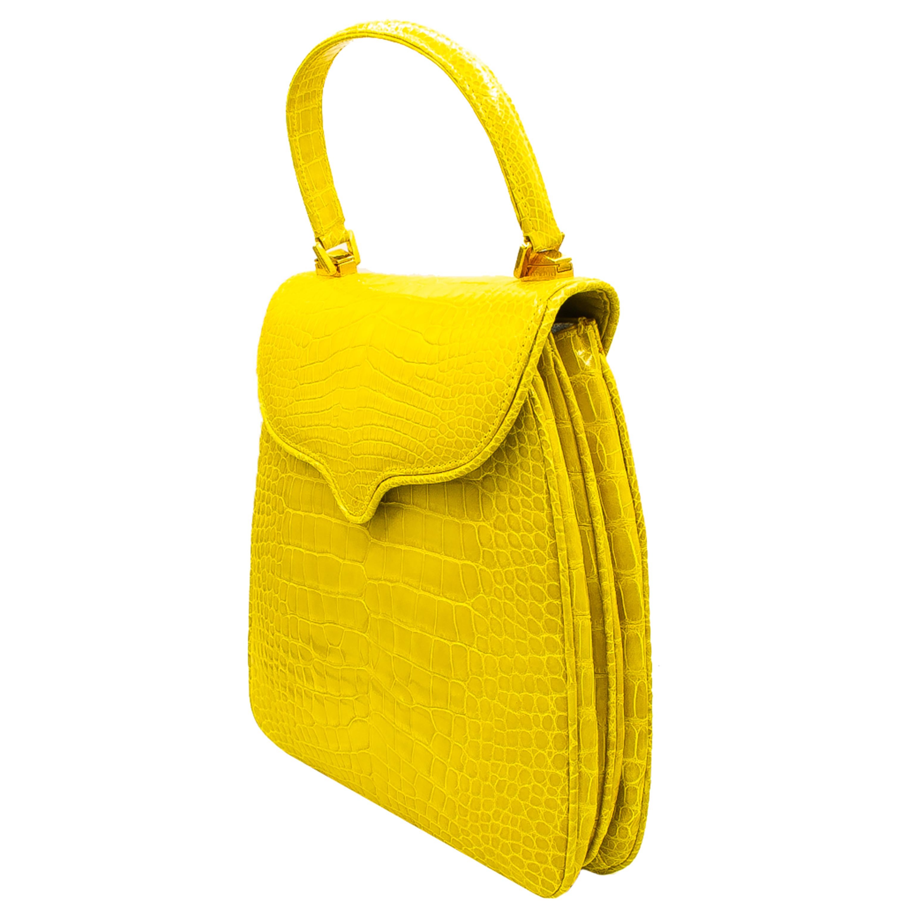 Crazy fun lemon crocodile handbag with rose gold color hardware. This Bag has 2 main pockets, 1 small side pocket, a small zippered section and an exterior pocket. Handle can be removed. Made in Italy. Originally sold for $9,800 retail. This is a