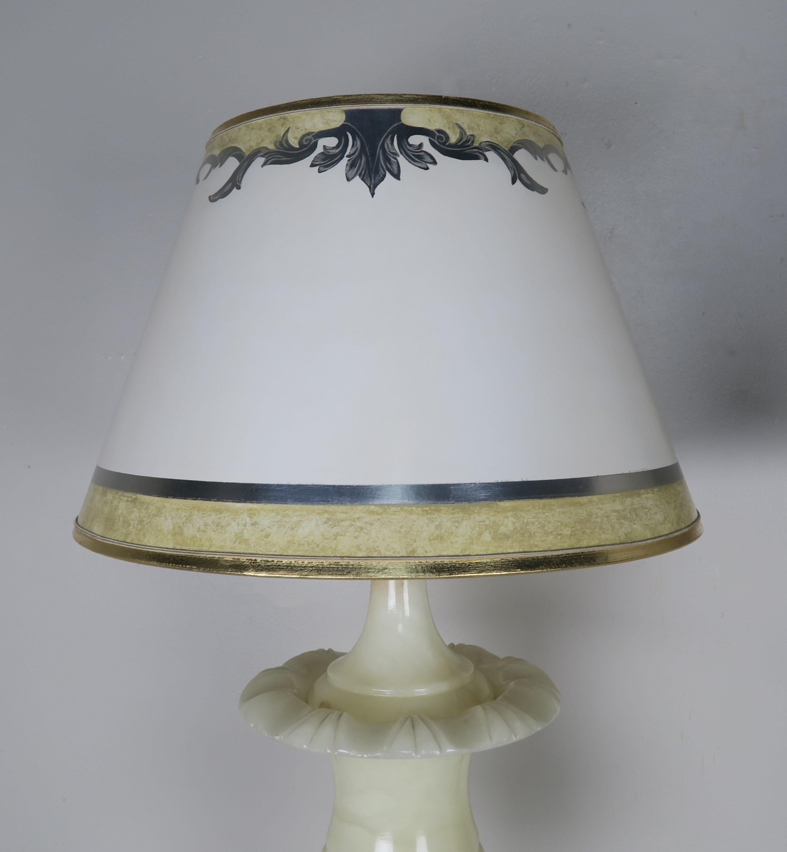 Cream alabaster urn shaped lamps with hand painted parchment shades. The lamps have been newly rewired and crowned with custom hand painted parchment shades.
