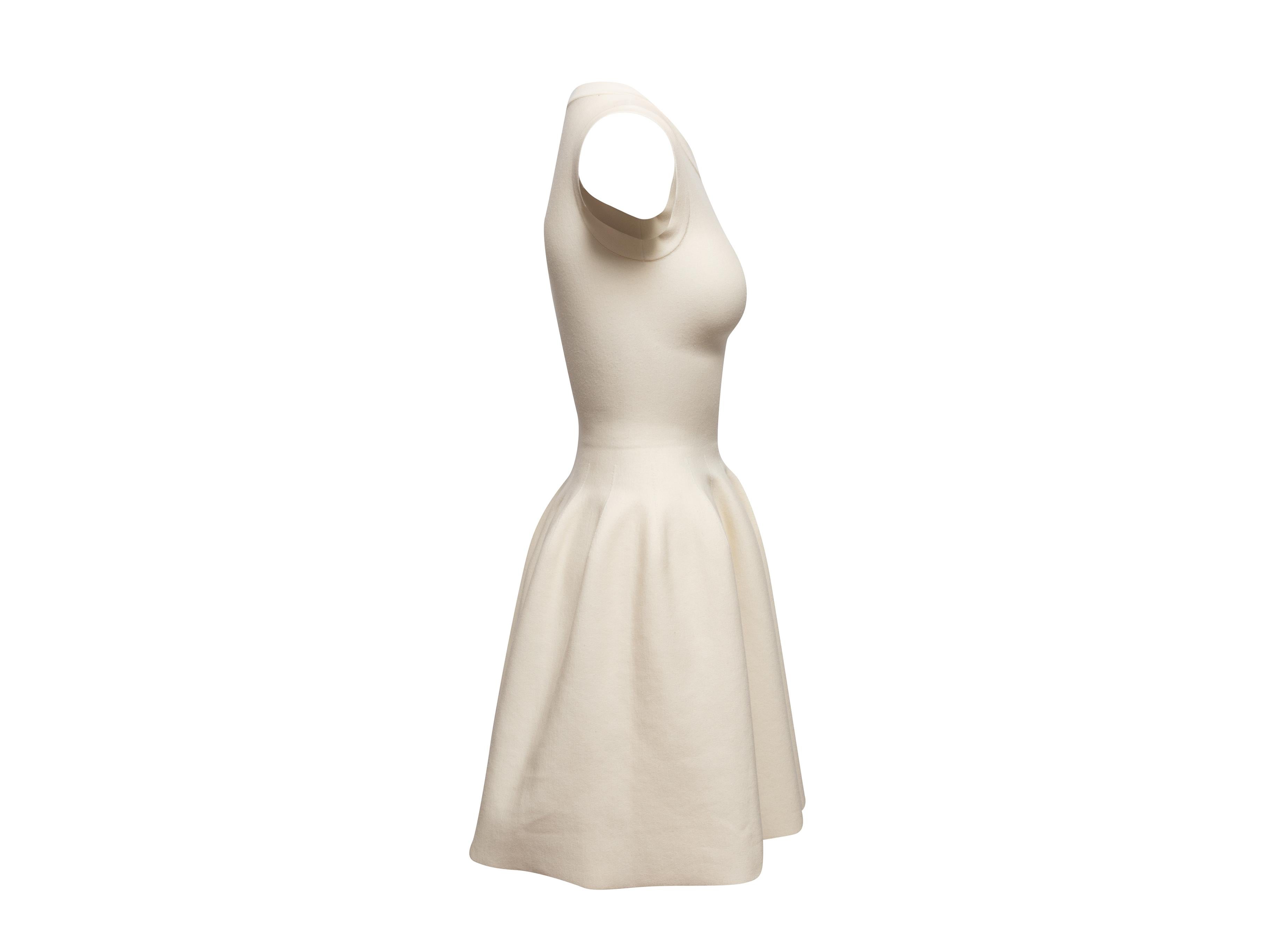 Product Details: Cream sleeveless fit and flare dress by Alaia. Crew neck. Zip closure at center back. Designer size 36. 25