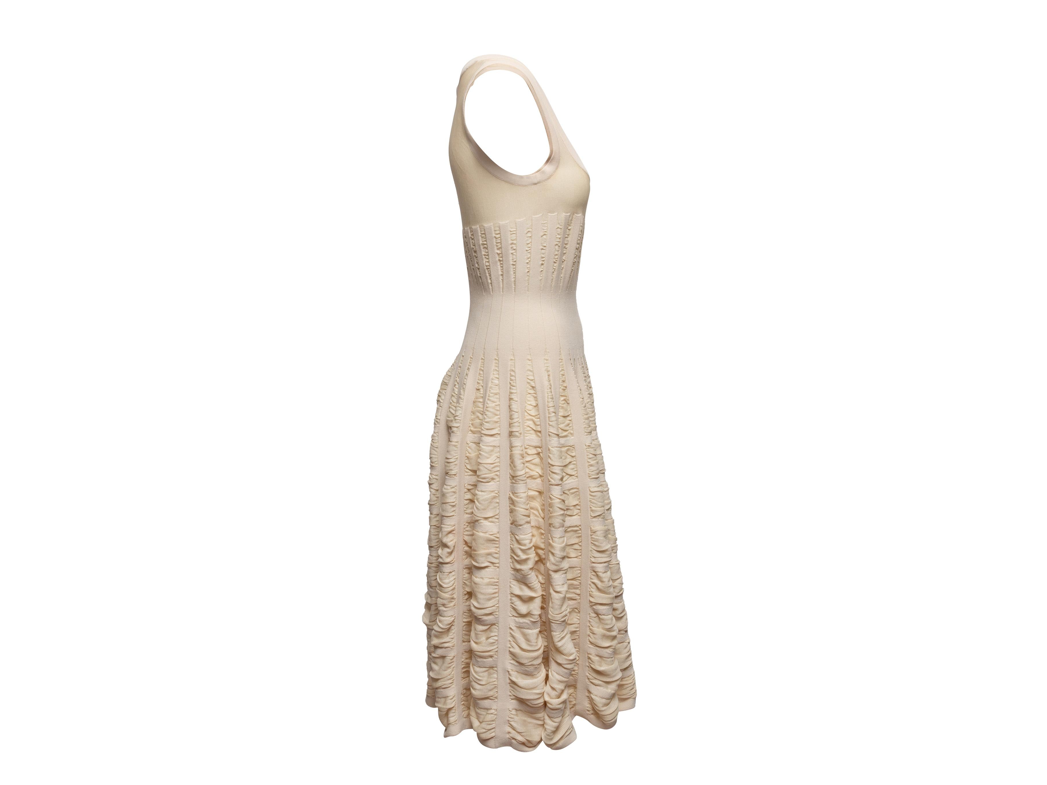 Product Details: Cream sleeveless ruched dress by Alaia. Scoop neckline. Zip closure at back. 30