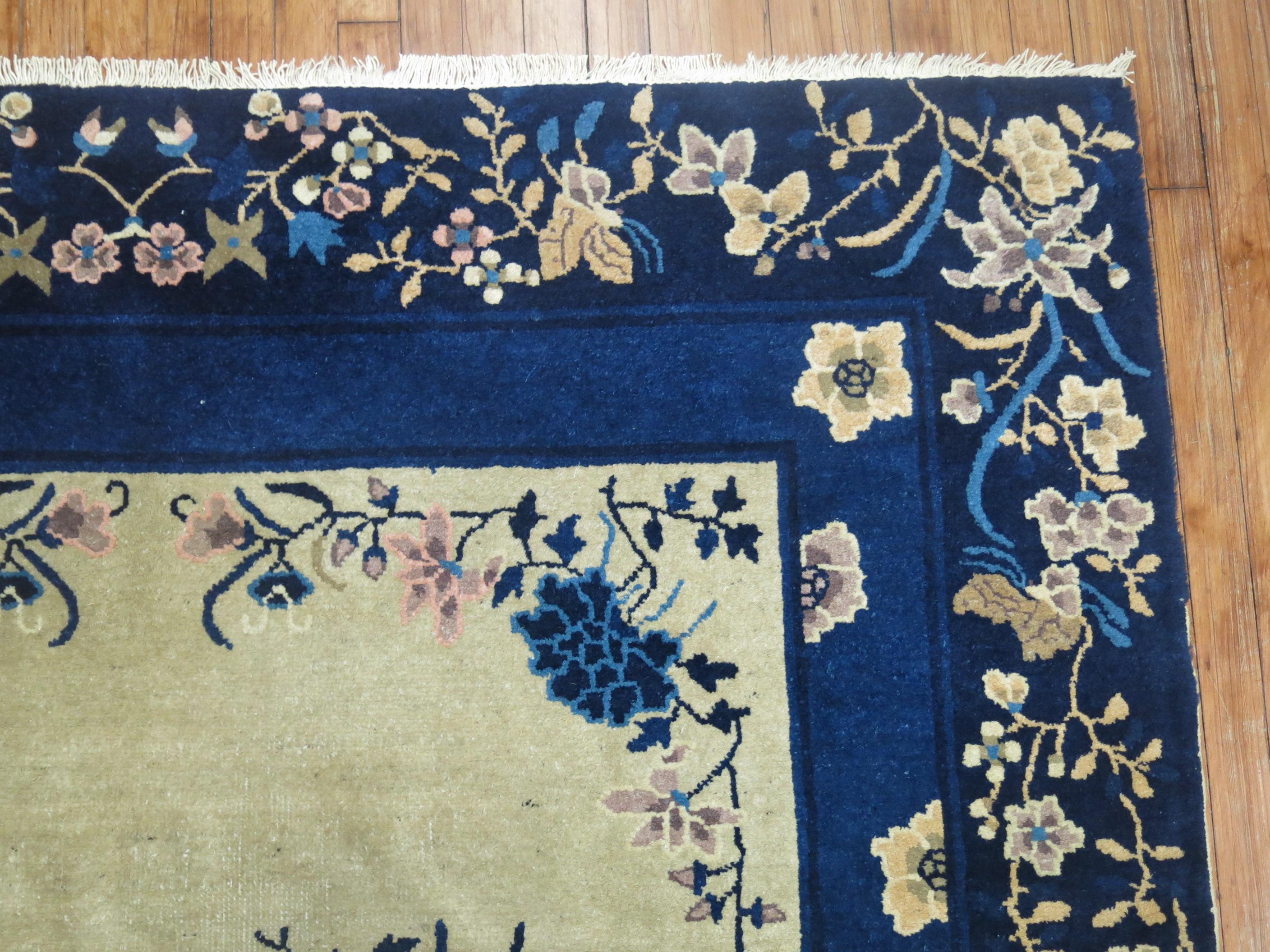 An early 20th century floral Chinese rug in beige and navy Blue

6'2'' x 9'

Peking rugs consist of designs that are simpler and asymmetrical, often tending toward modern western Art Deco taste.
