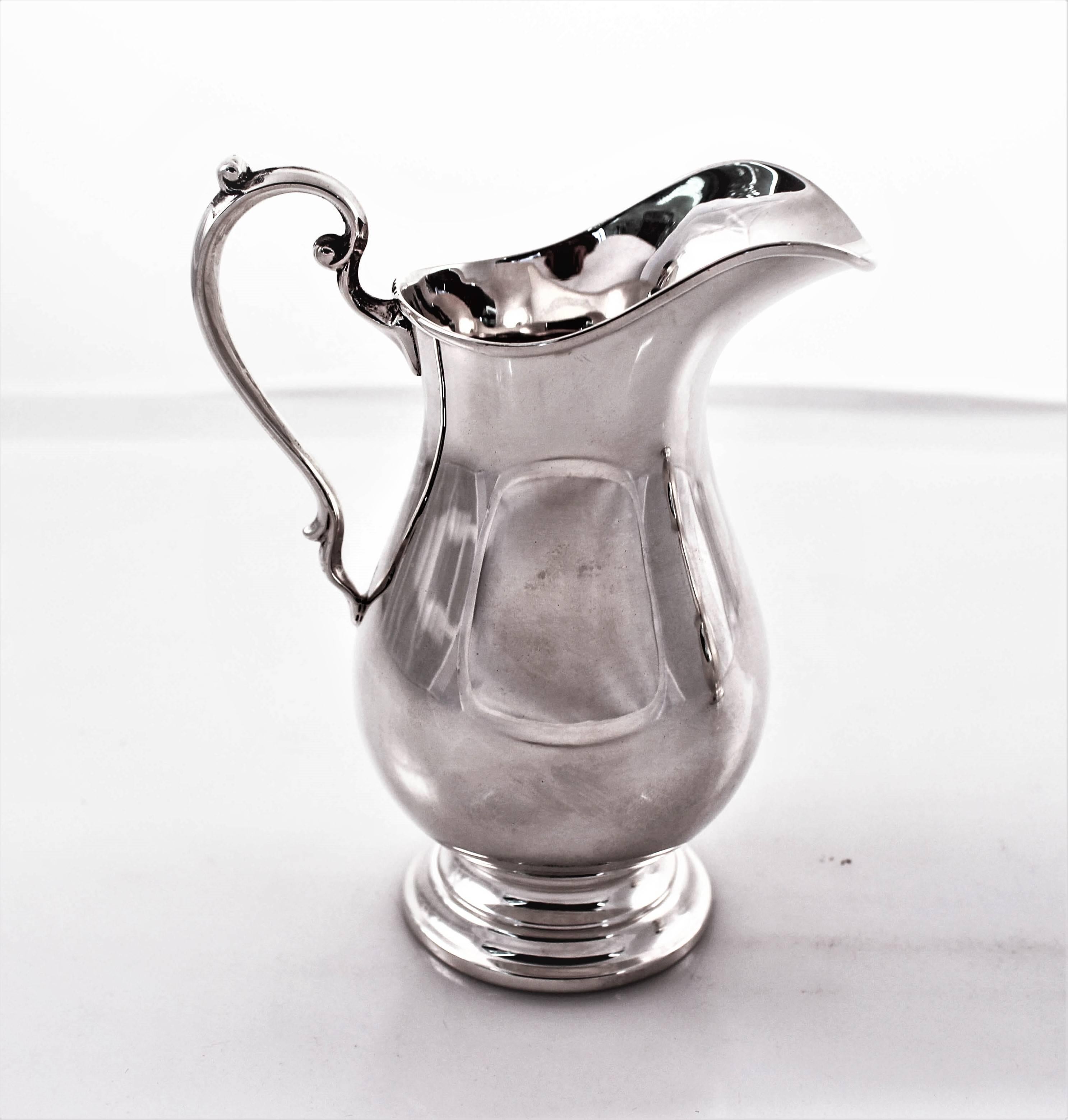 This cream and sugar bowl set will compliment any home decor or style. They have a Classic look that is timeless. The handles have a slight swirl to give a little design; the pieces themselves are without etching or pattern. Reflective of the late