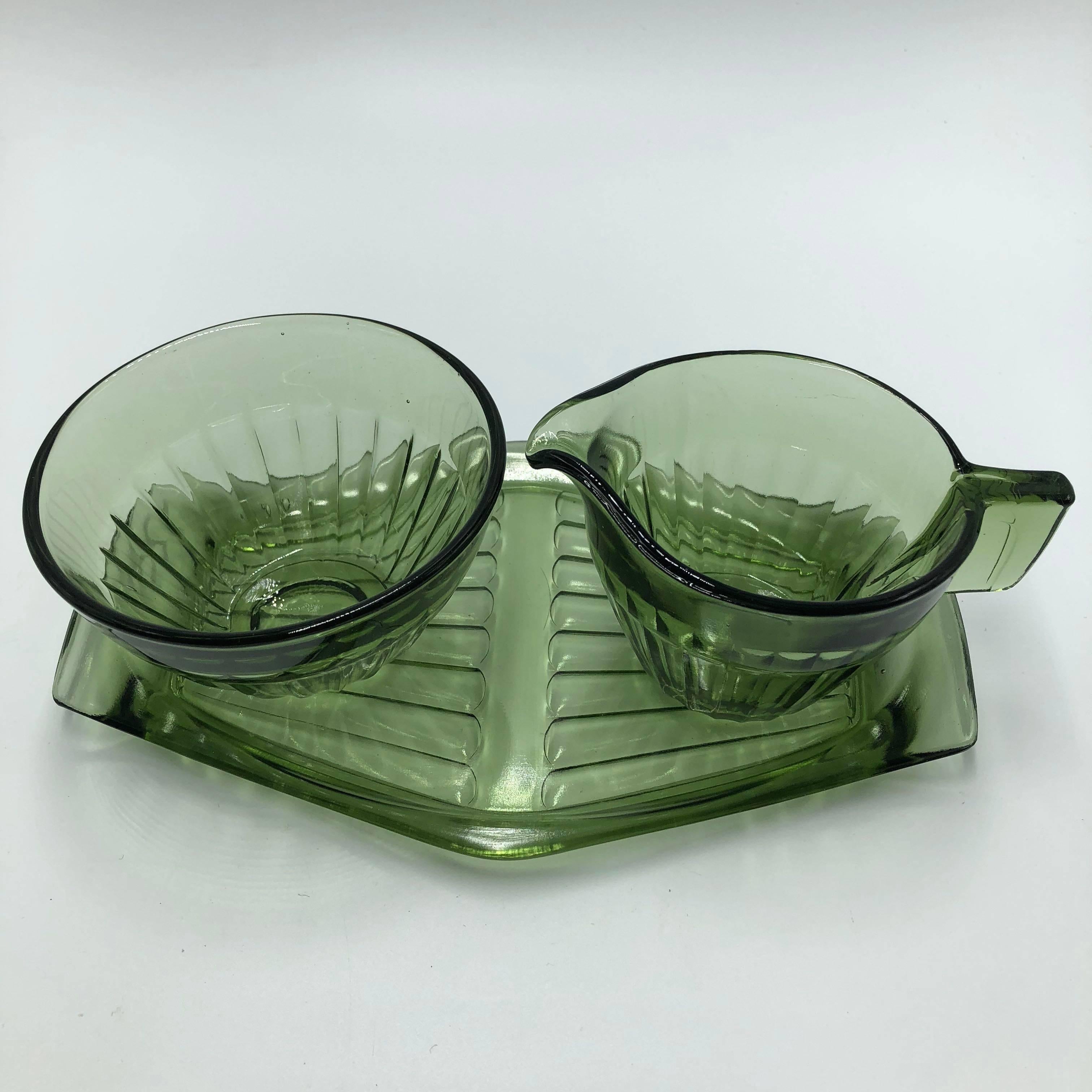 In silvergreen pressed glass milk and sugar set on a tray.
In very good condition. 
A.D. Copier is a distinguished Dutch glass designer (1901-1991).