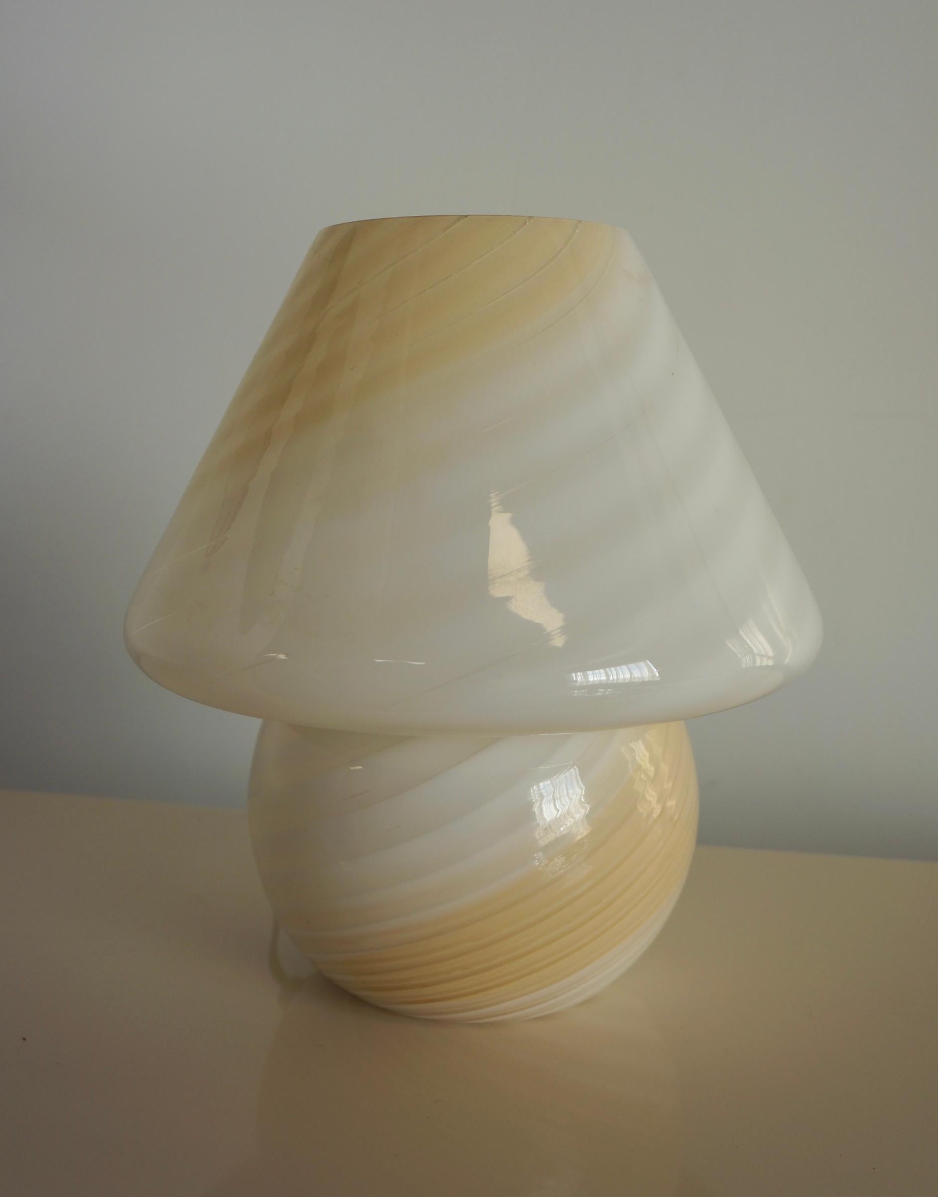 Medium sized cream and white ombré  Murano mushroom lamp made in the swirl technique. Murano Art glass is considered to be one of most expertly crafted art glass in the world and is made with incredible detail. The murano mushroom lamps were